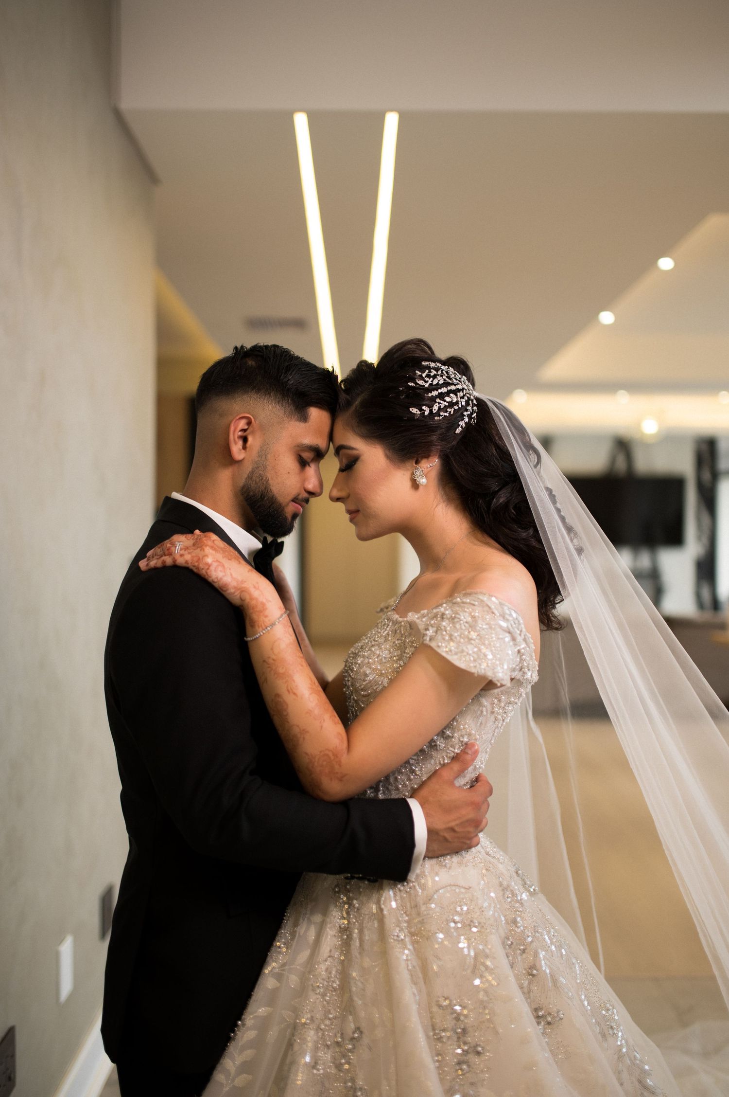 Romantic wedding portrait capturing intimate moment between newlyweds.