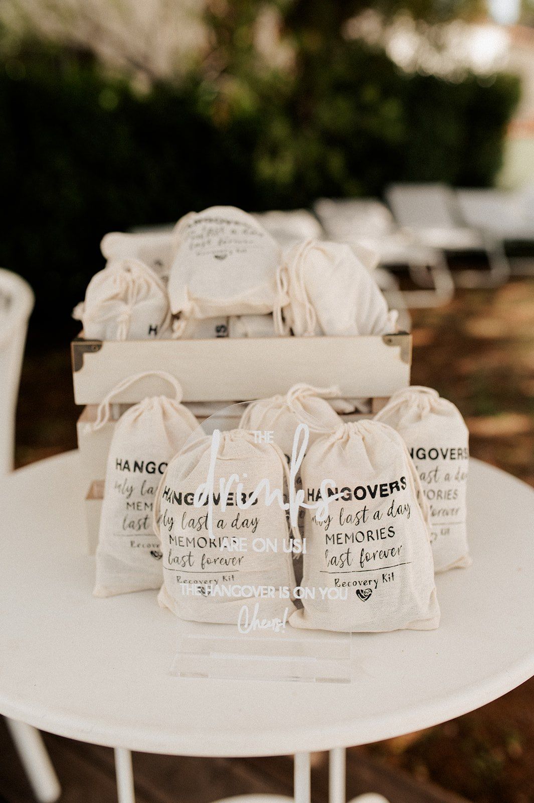 Wedding hangover recovery kit favor bags with text reading Hangovers only last a day, Memories last forever.