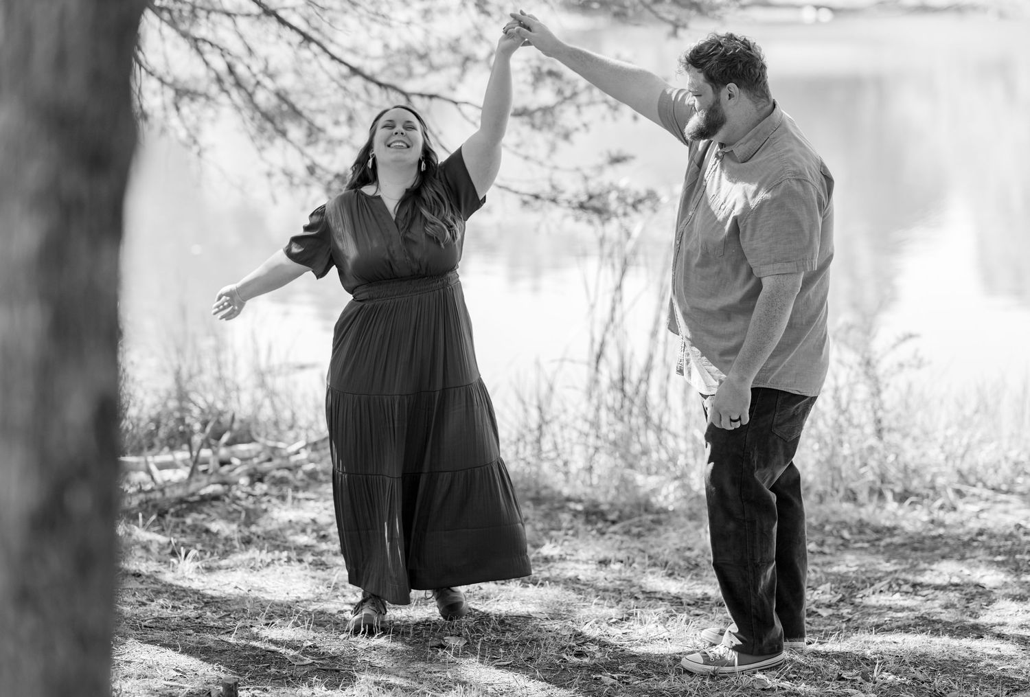 Black and white sequence of couple laughing together outdoors.