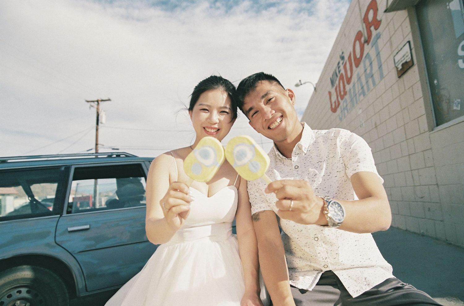 Casual outdoor scene with ice cream treats near a building.
