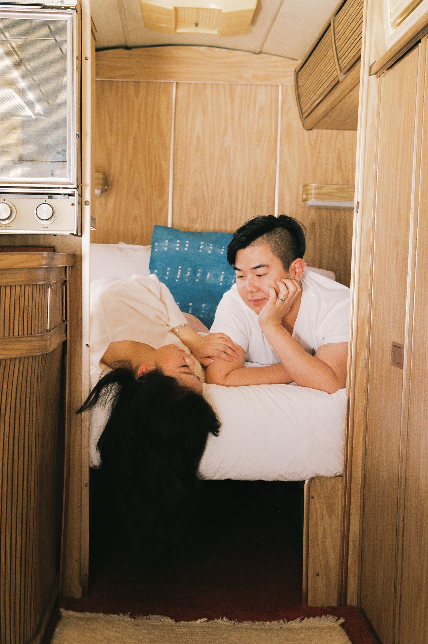 A relaxing moment inside a wooden RV interior with sheet music decor.