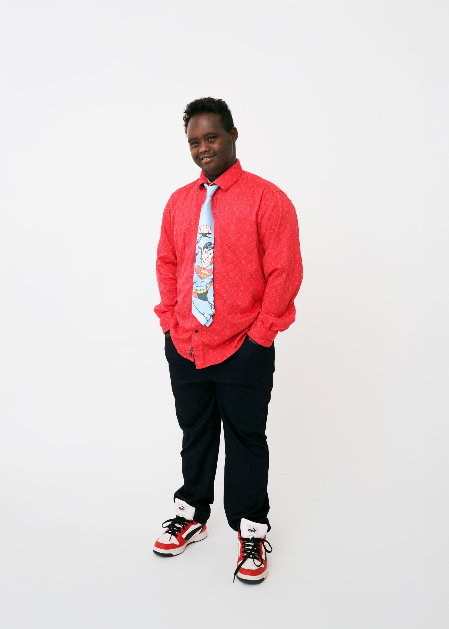 A series of poses showing a person in a red jacket, tie, and black pants against a white background.