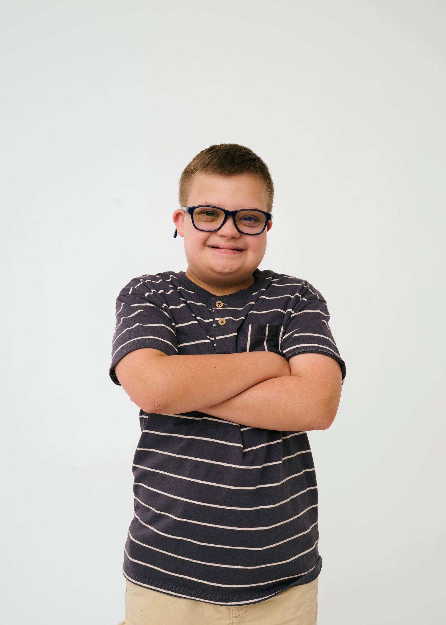 Three poses of someone wearing a striped polo shirt against a white background.
