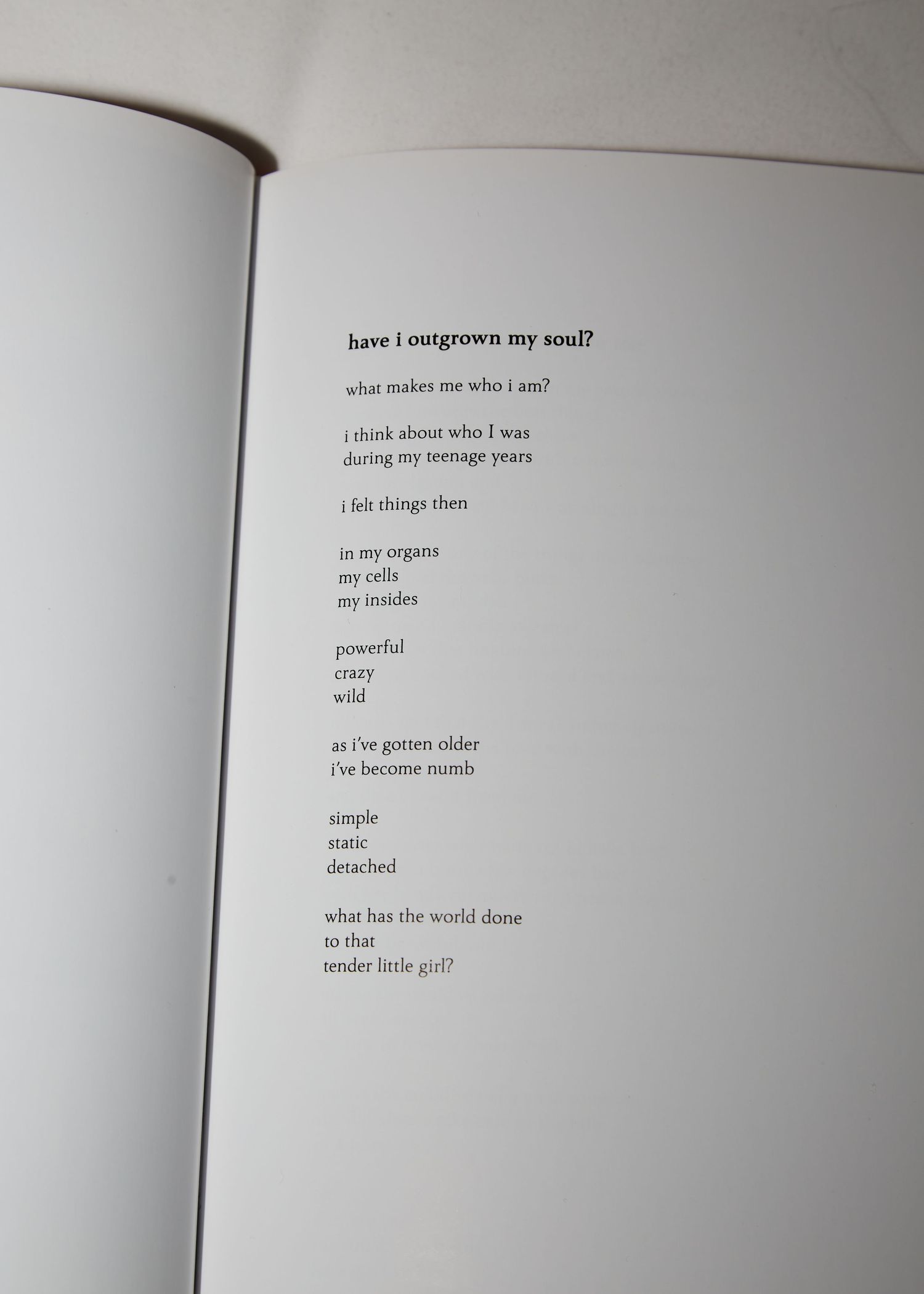Page from a poetry book with minimalist text layout.