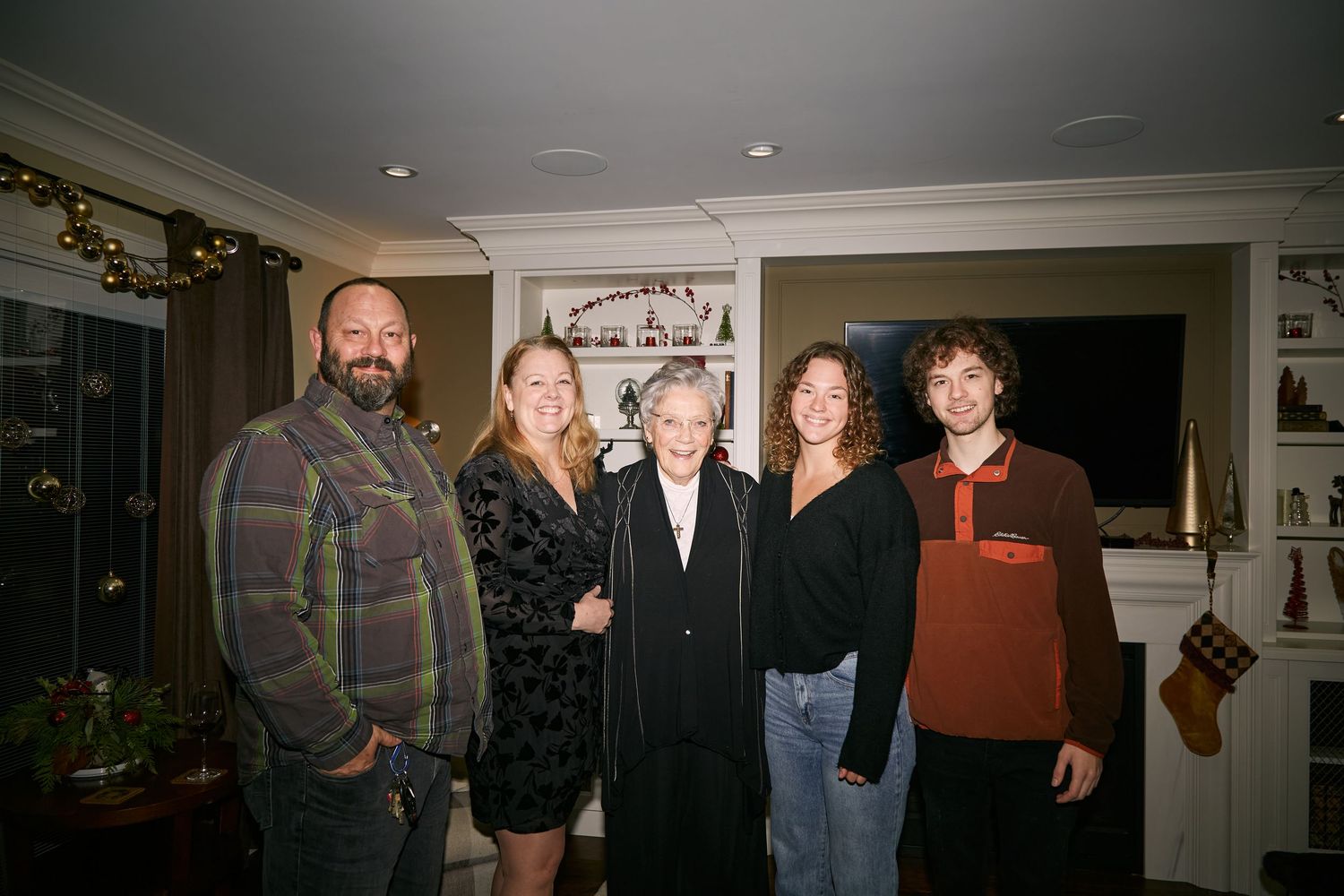 A series of five connected photographs showing people gathered at what appears to be an art gallery or exhibition space.