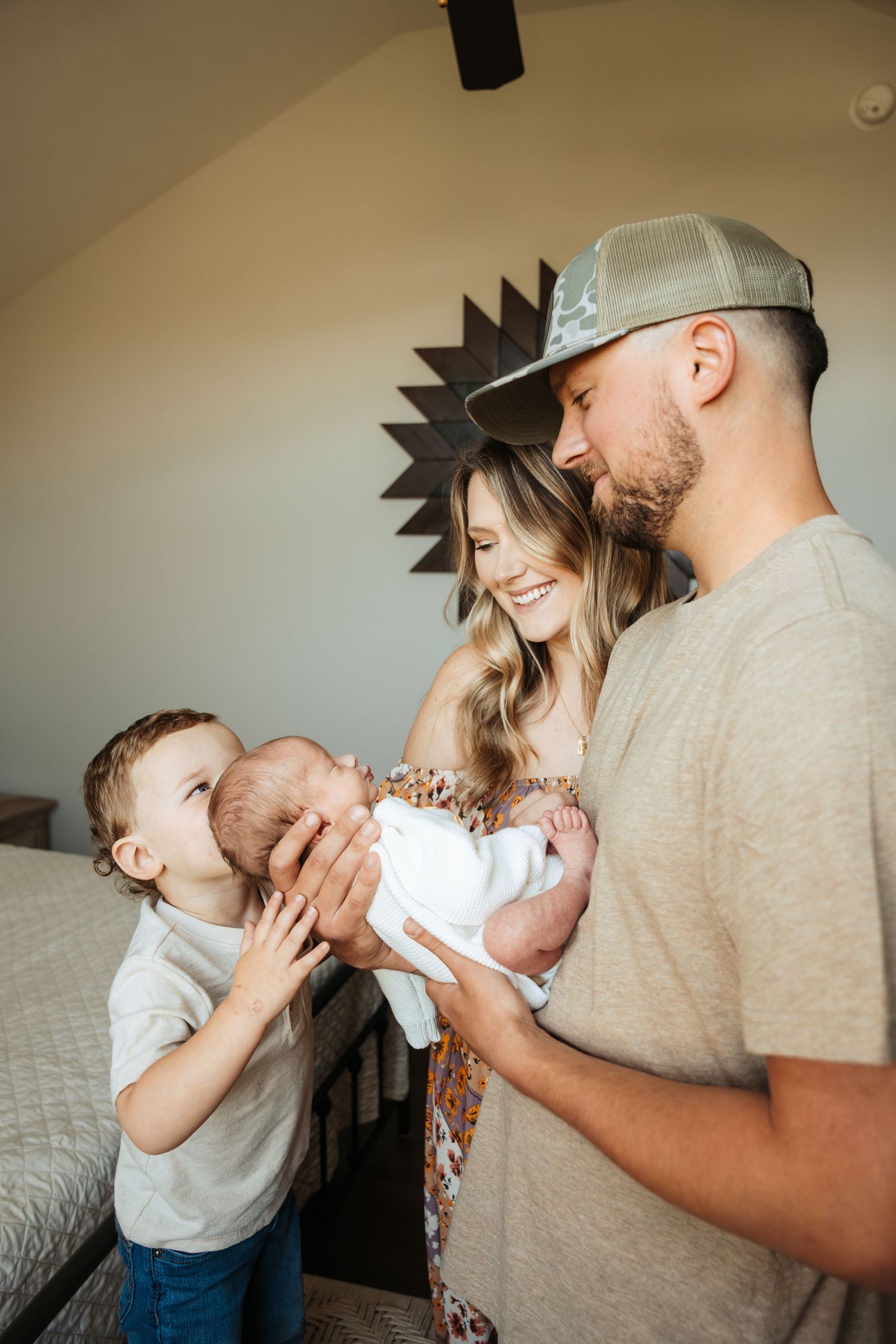 Heartwarming family photos showing tender moments between parents and children on bed.