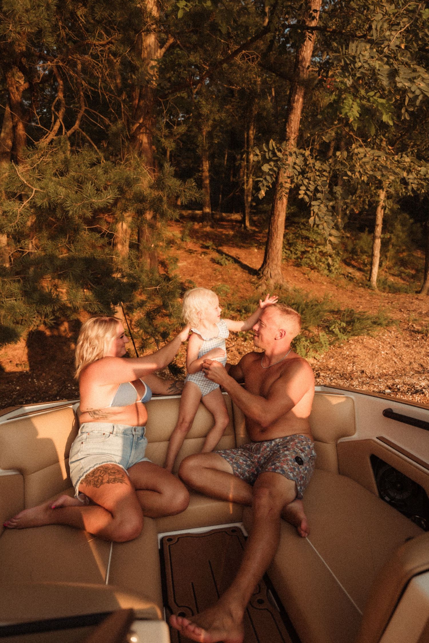 People relaxing on a pontoon boat during a sunset cruise.