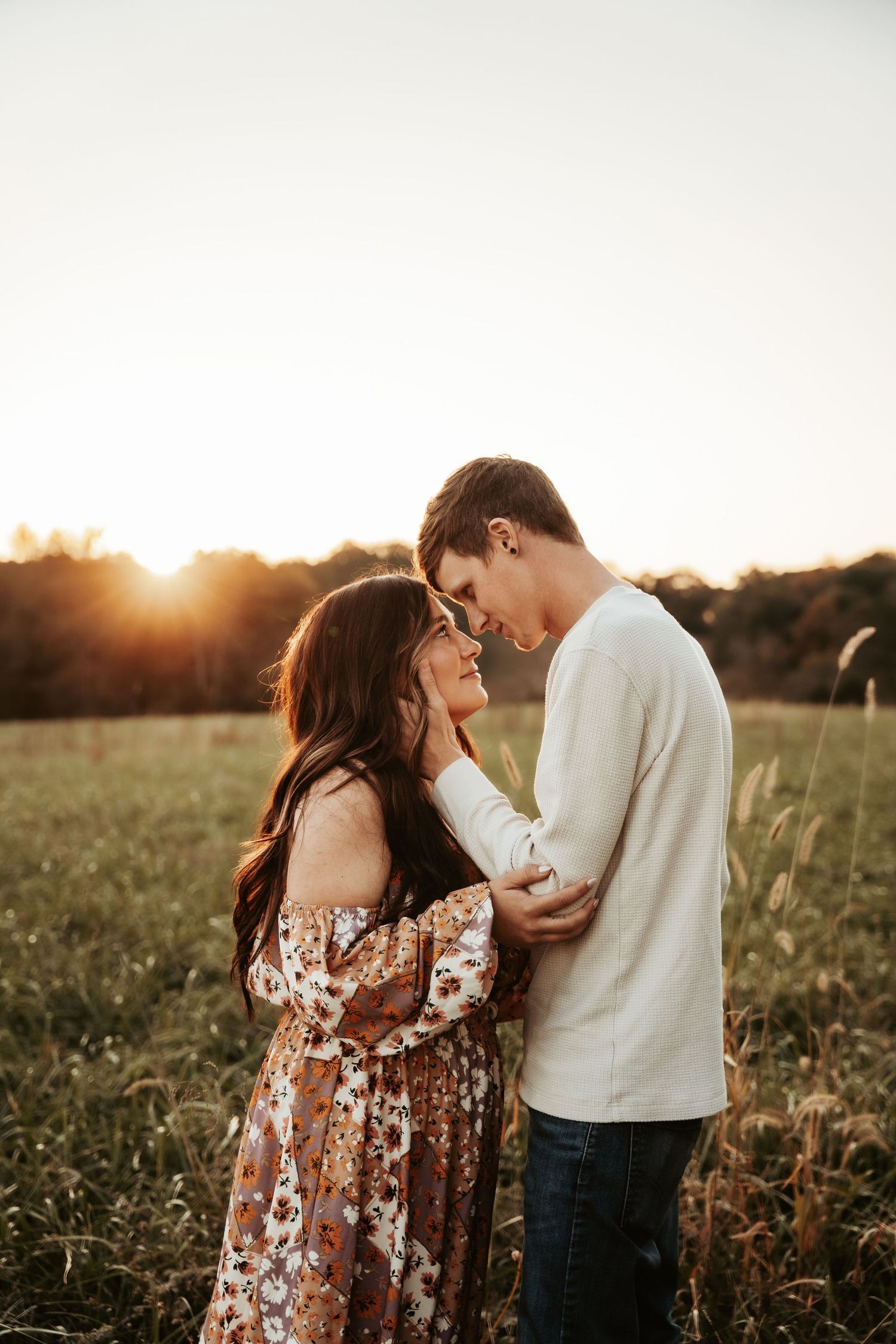 A romantic sunset photoshoot in a golden field.