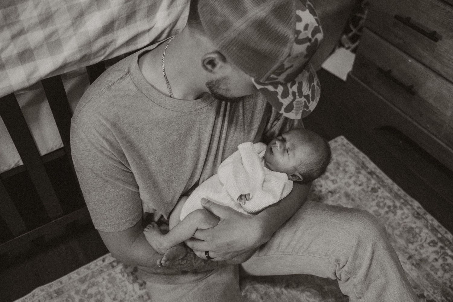Black and white candid family photos showing intimate moments at home.