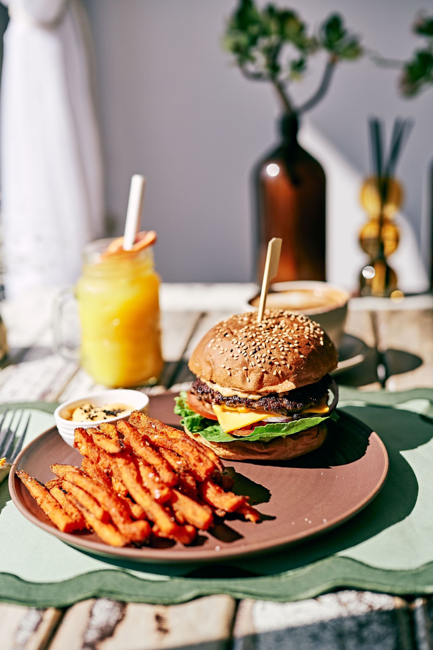 yummy burger on a  table in a cafe with fries