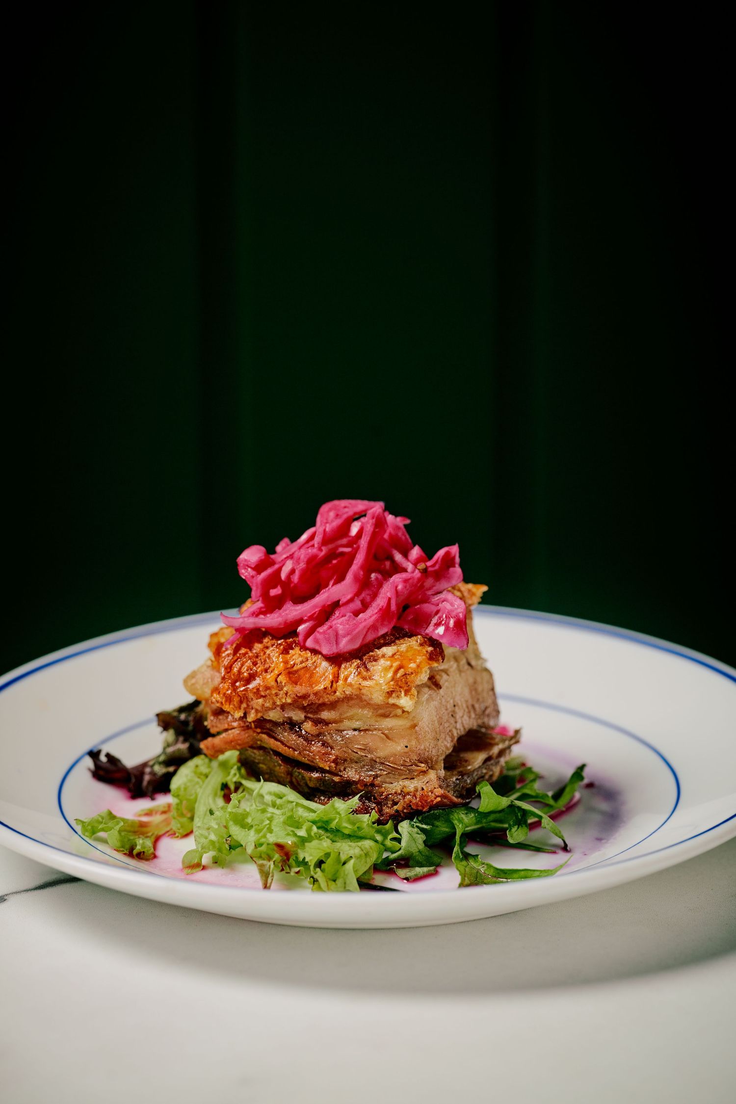 Crispy pork belly with golden crackling and a caramelized apple puree