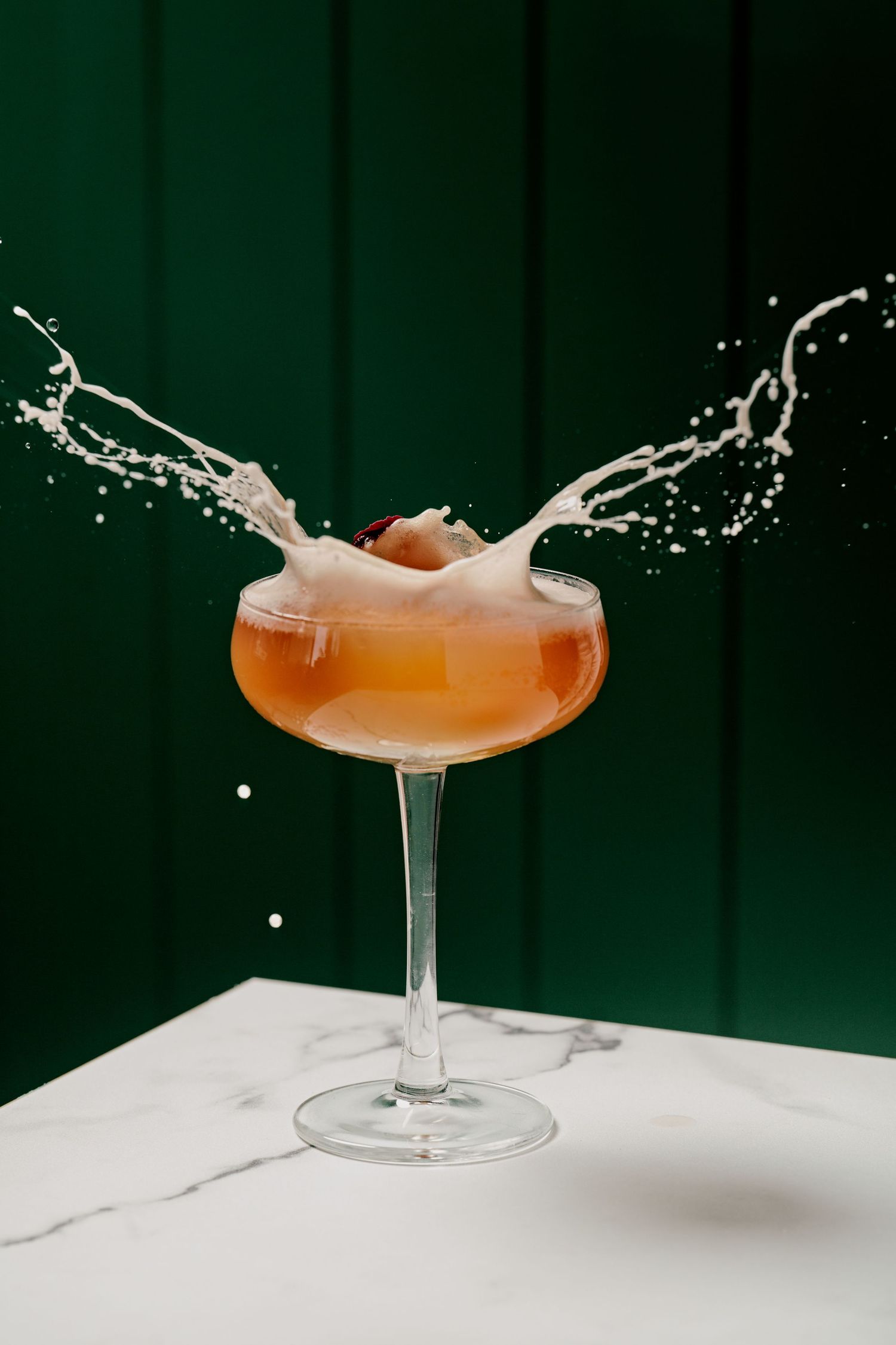 Peach flavoured cocktail with flowers.
