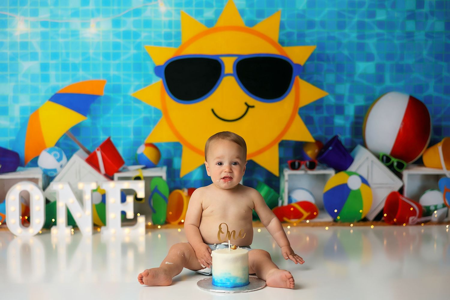 Summer beach party scene with bright yellow sun backdrop and pool toys.