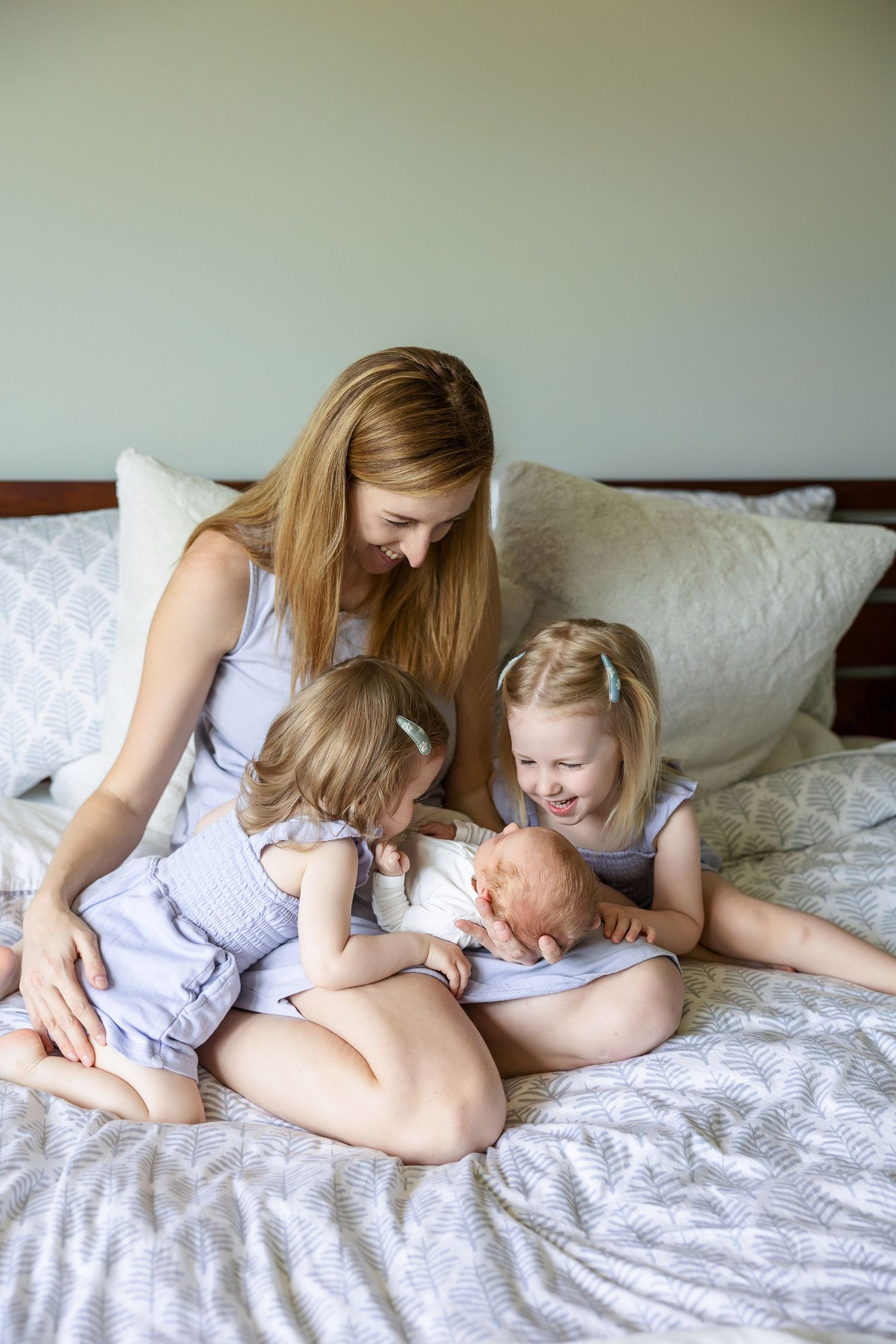 Mother and child sharing tender moments on a white bed in a progression of heartwarming interaction shots.