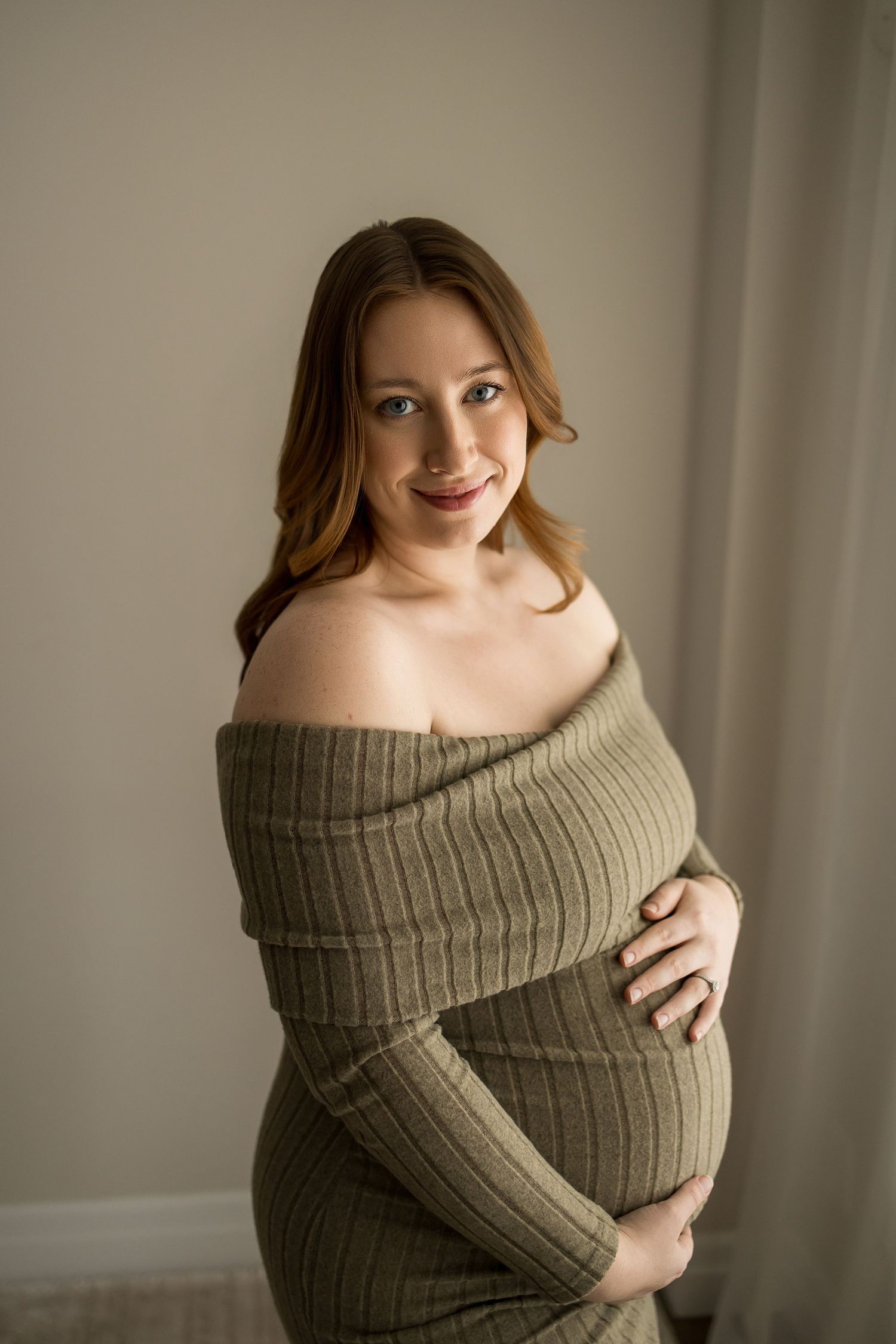 A series of artistic maternity photos showing a woman in a cozy beige sweater against a neutral background.