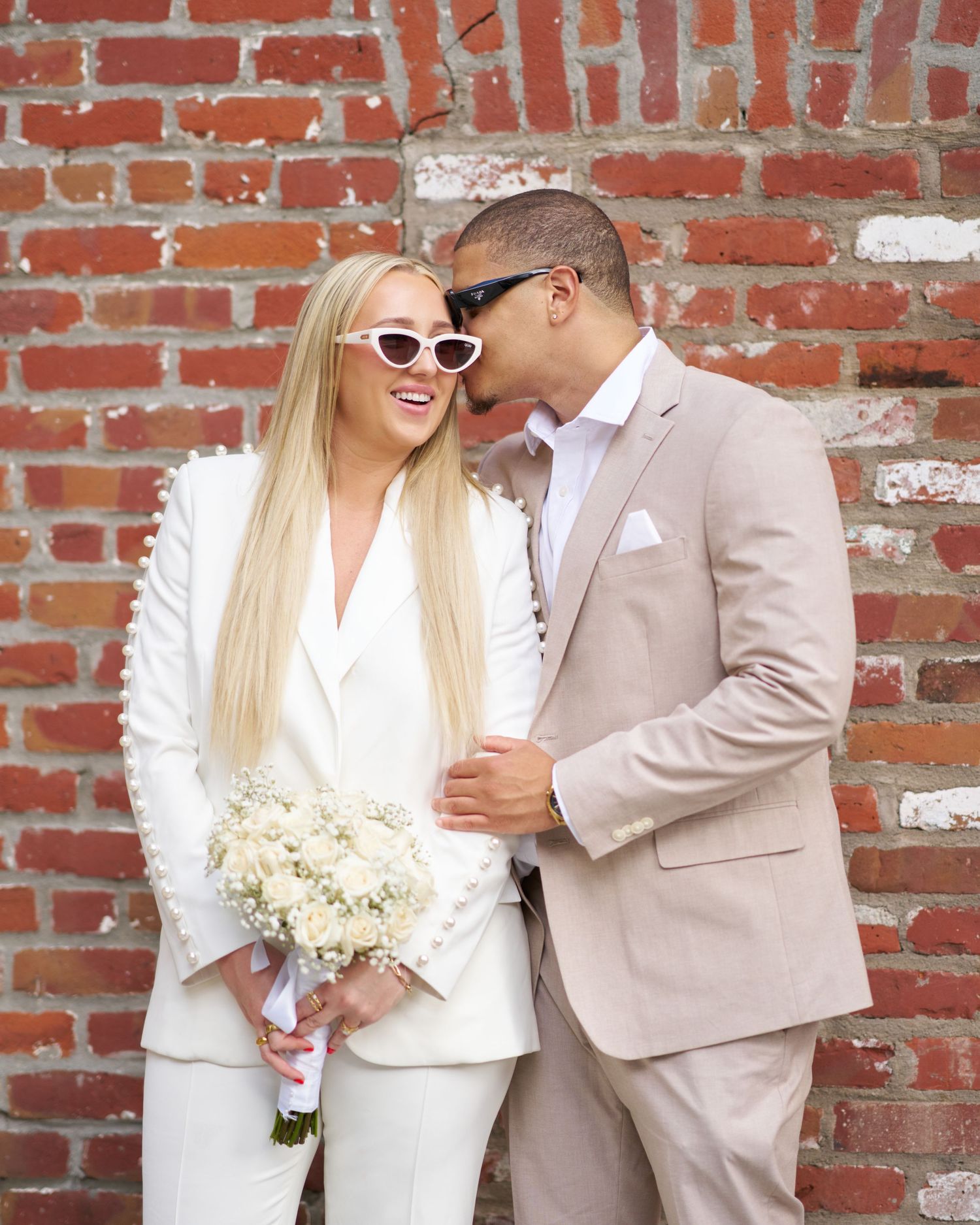 A couple laughing together during an engagement shoot.