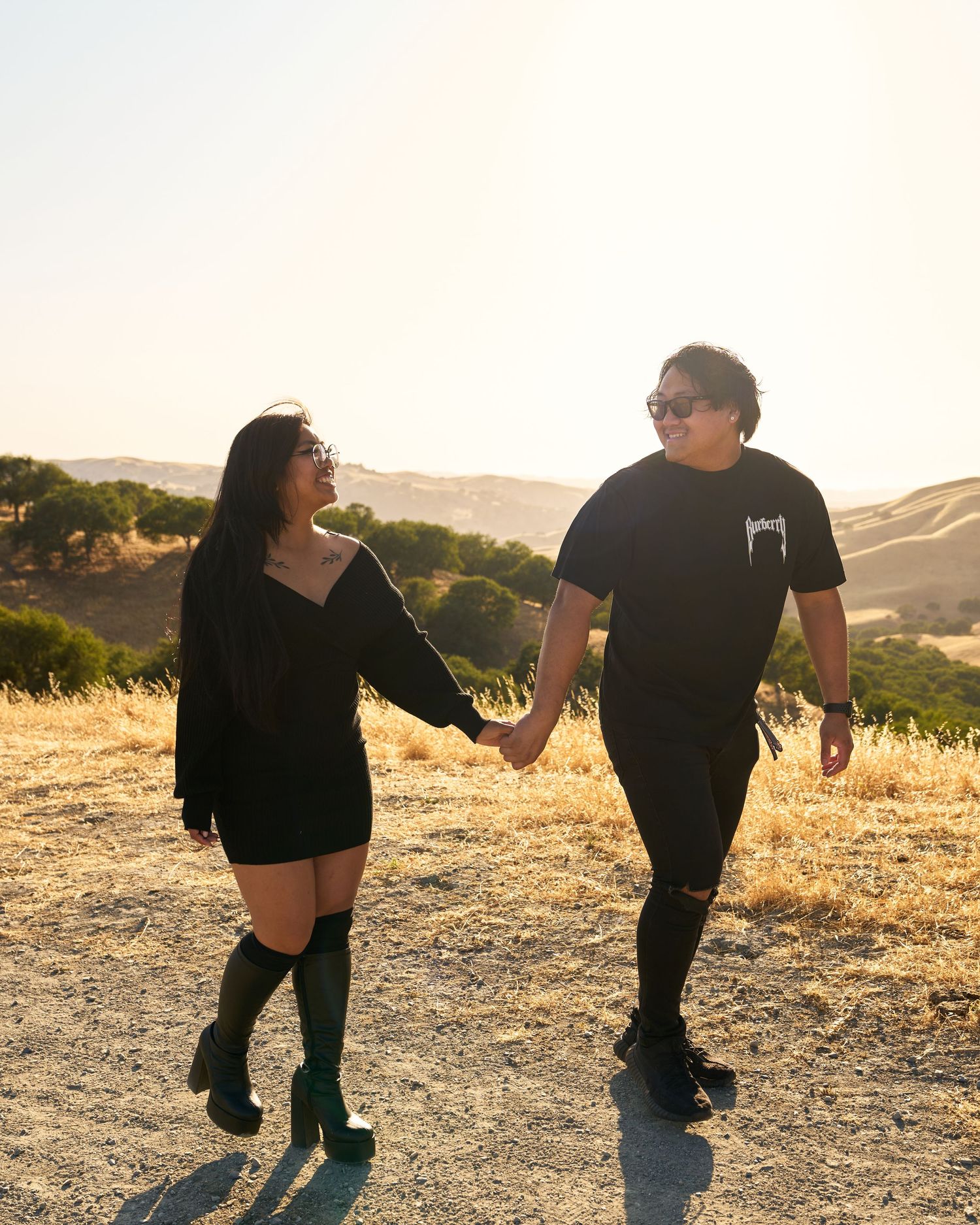 A couple holding hands outdoor.