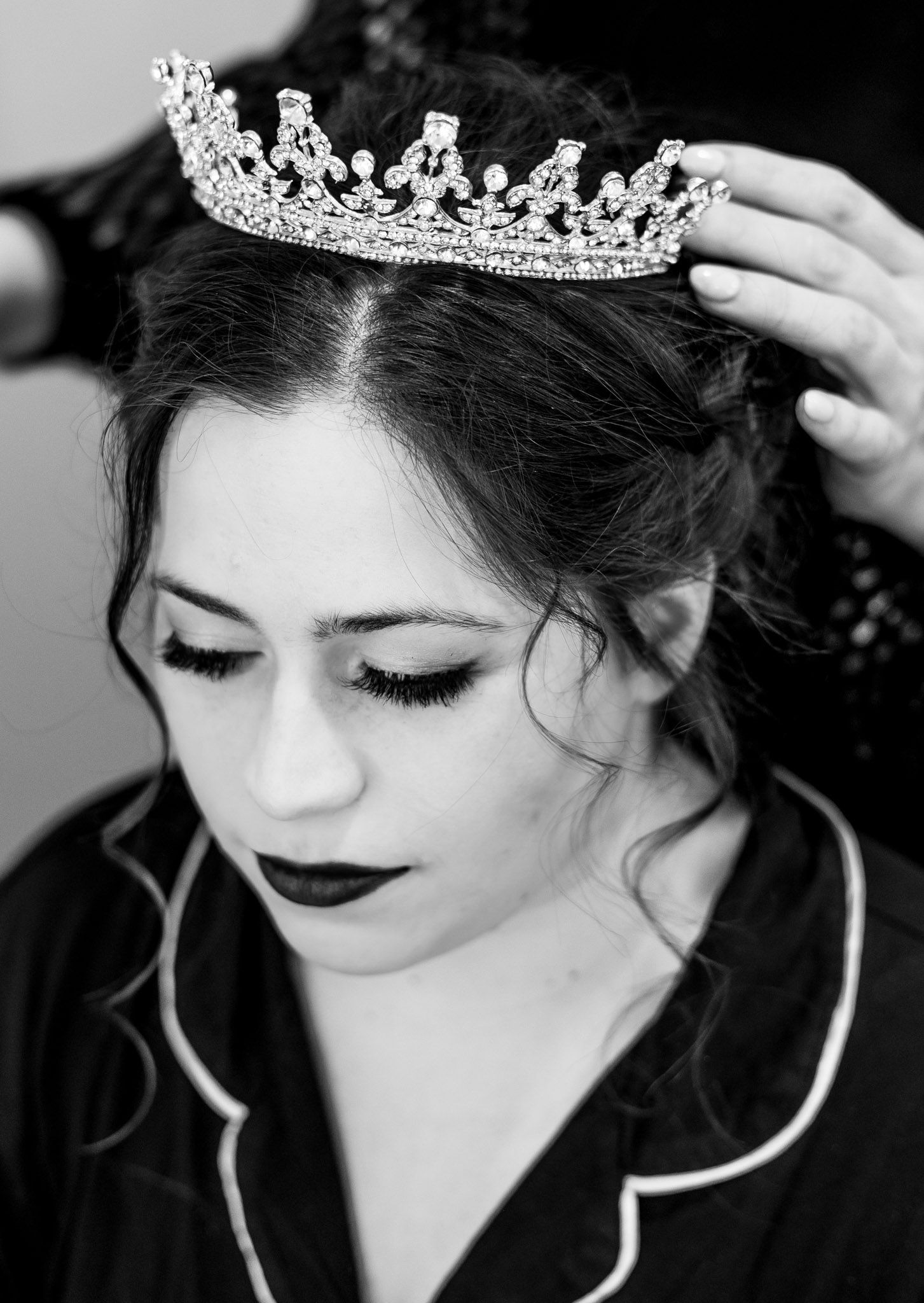 bride getting ready putting on a crown
