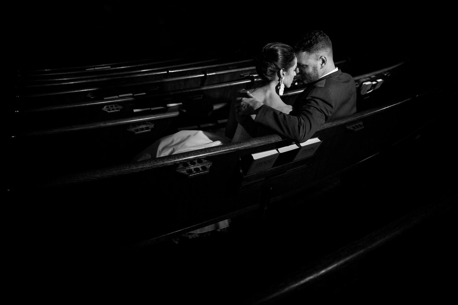Black and white photo of married couple in a church