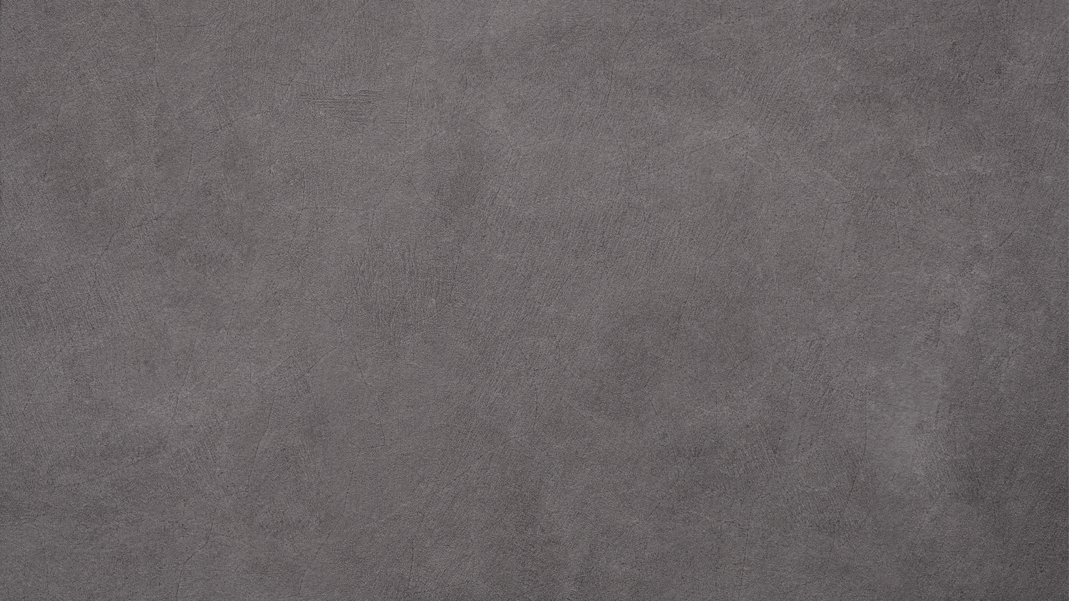 Dark gray concrete texture surface with subtle variations and smooth matte finish.