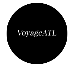 VoyageATL logo in white serif font centered on a black circle background.
