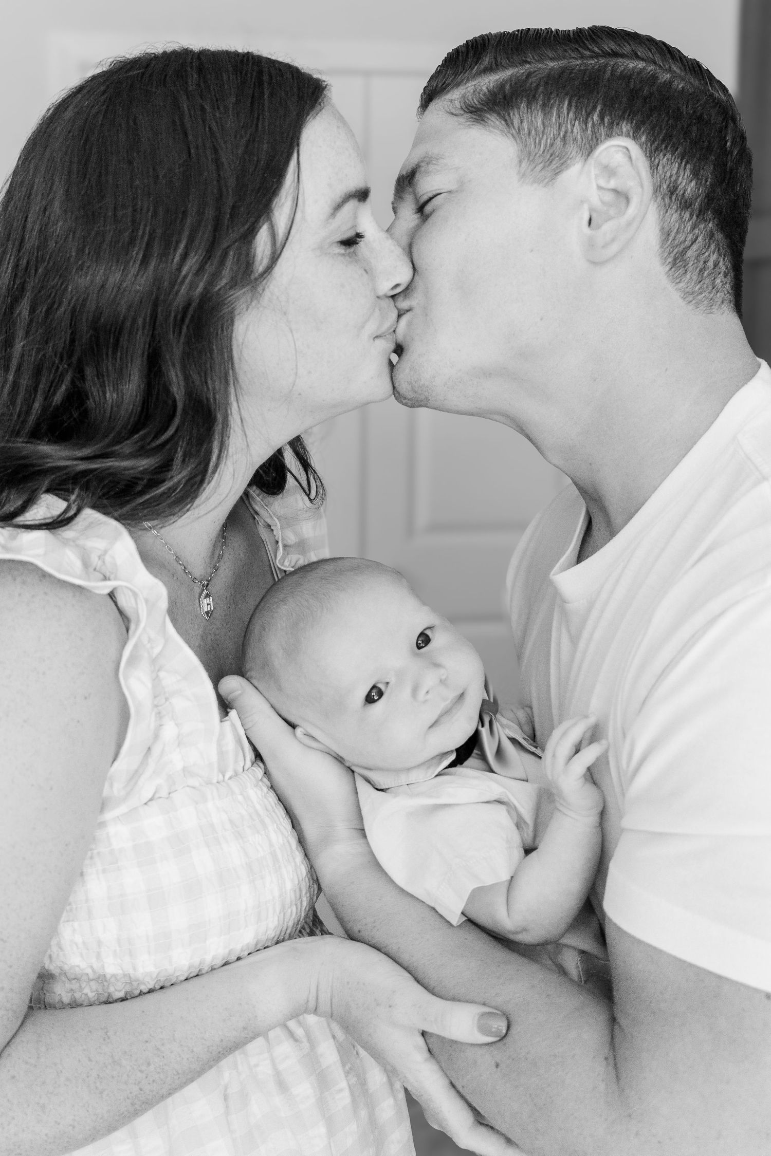 Black and white portrait of tender family moment.