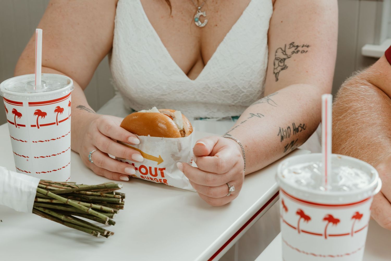Wedding reception detail of In-N-Out burger and drinks.