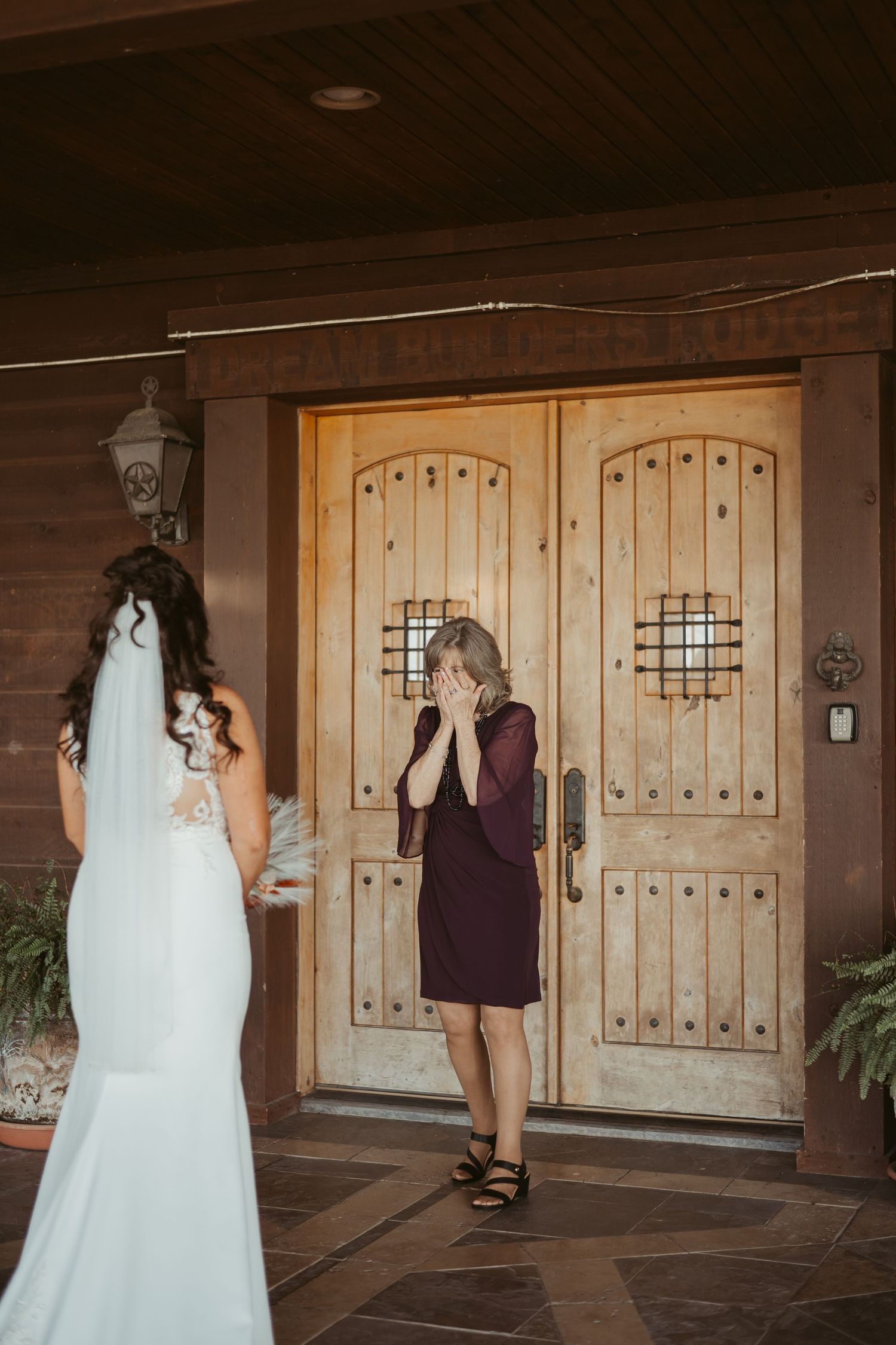 A series of photos showing a bride in a white wedding dress and another person in purple walking near wooden doors. Wedding photographer DFW