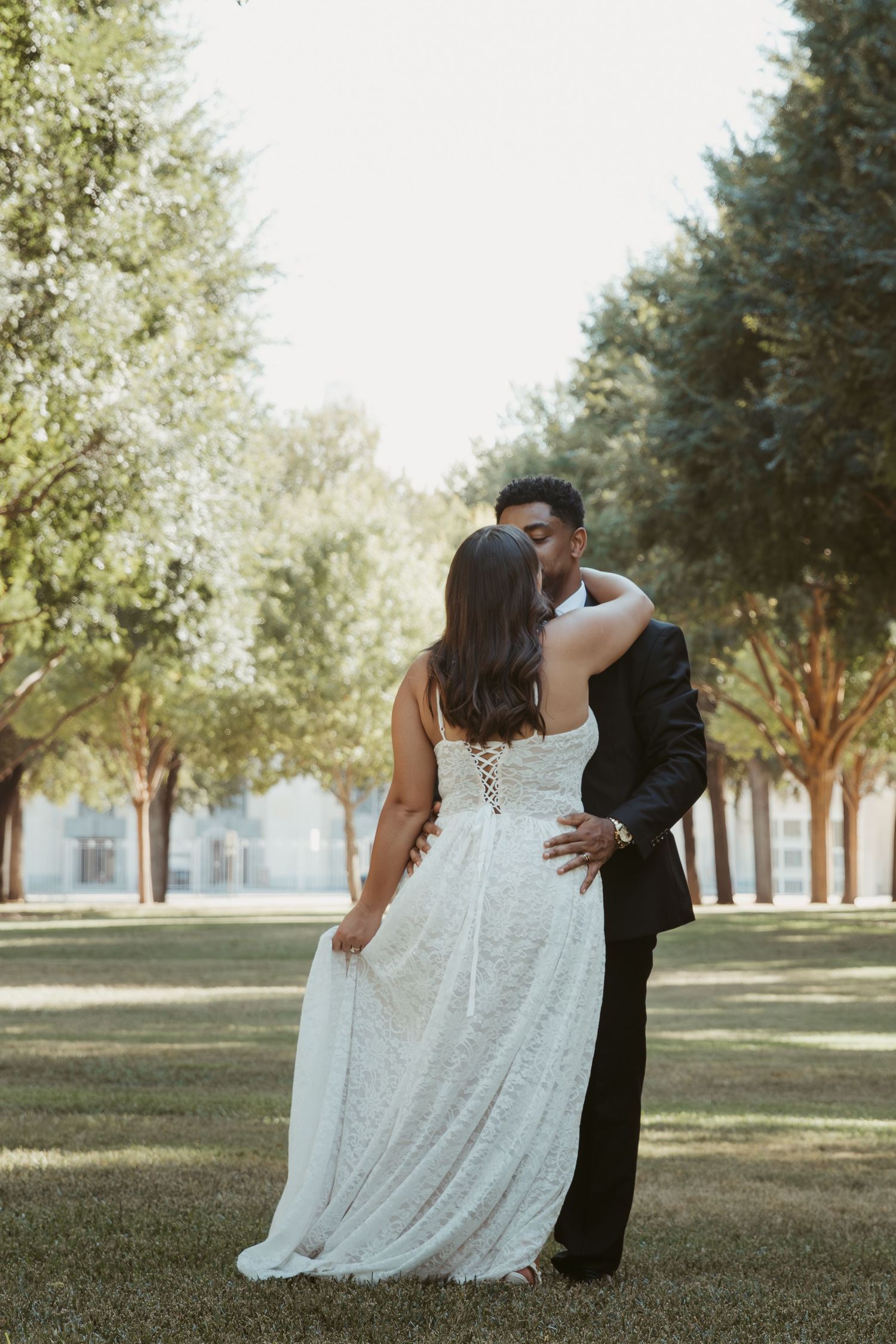 Romantic wedding photo sequence in a sunlit park with trees showing tender moments between newlyweds. Wedding Photographer DFW