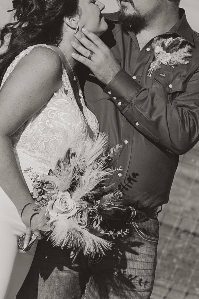 Black and white photo series of a romantic couple sharing intimate moments while dressed in wedding attire. Wedding photographer DFW