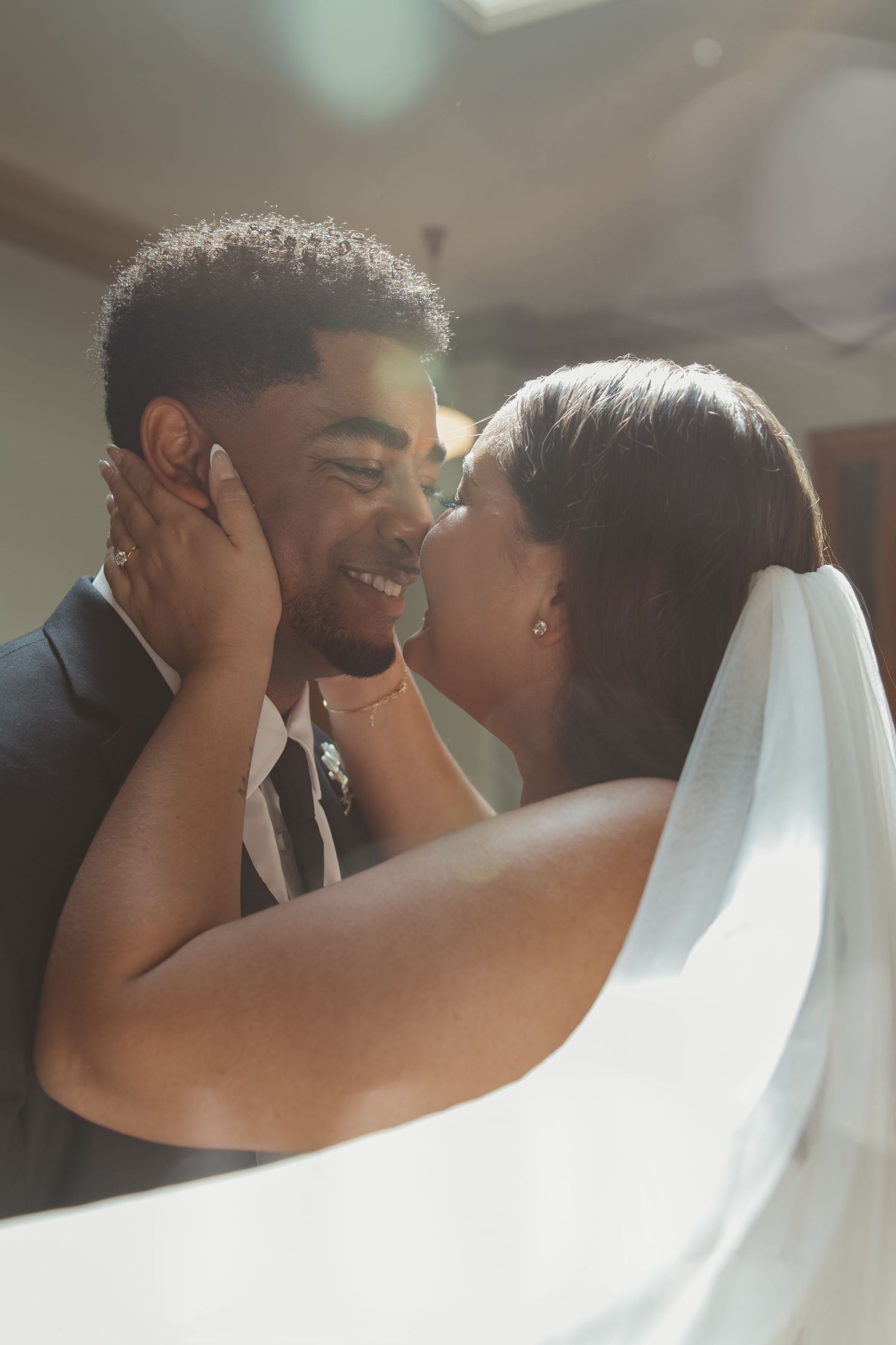 A tender wedding moment captured in soft lighting and intimate angles. Wedding Photographer DFW