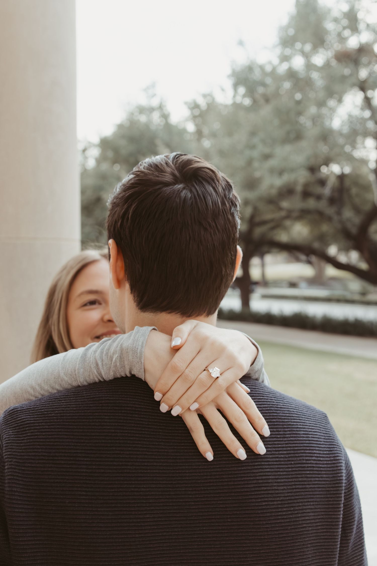 Close-up series of romantic engagement photos showing hands with ring embracing outdoors. engagement photos Fort Worth