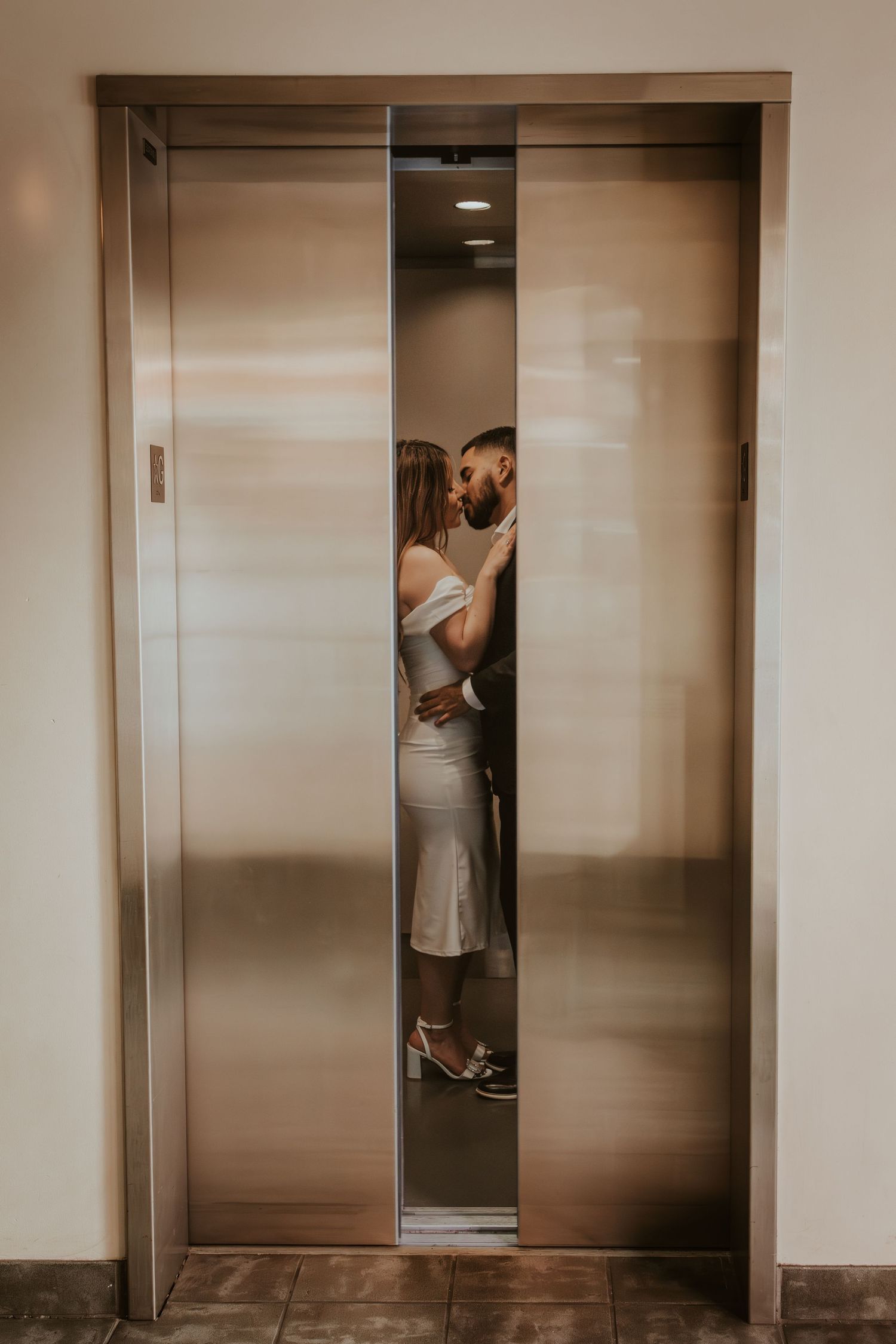 A romantic couple shares an intimate moment in an elevator doorway, shown in a sequence of photos.