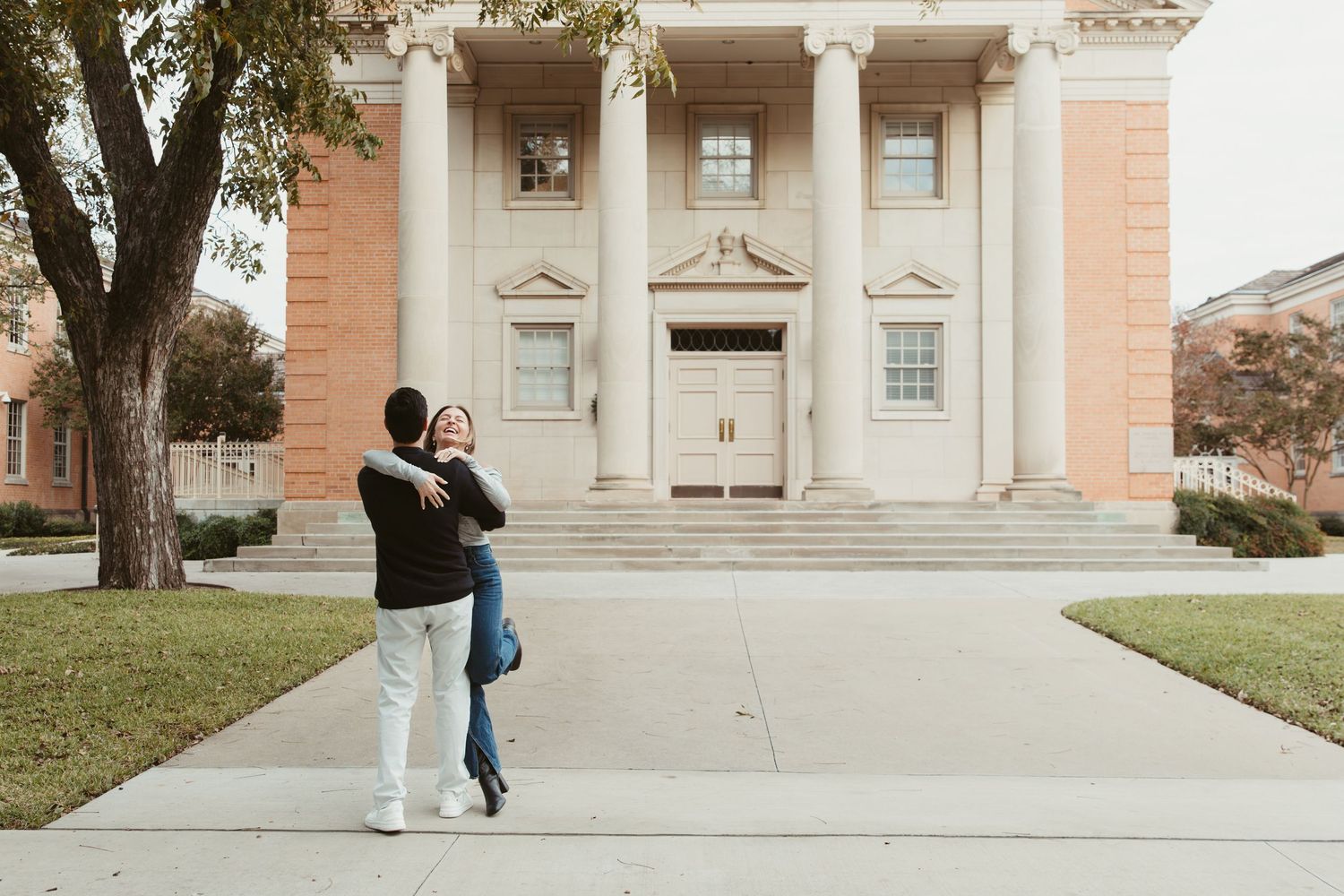 Candid engagement photos on TCU campus Fort Worth