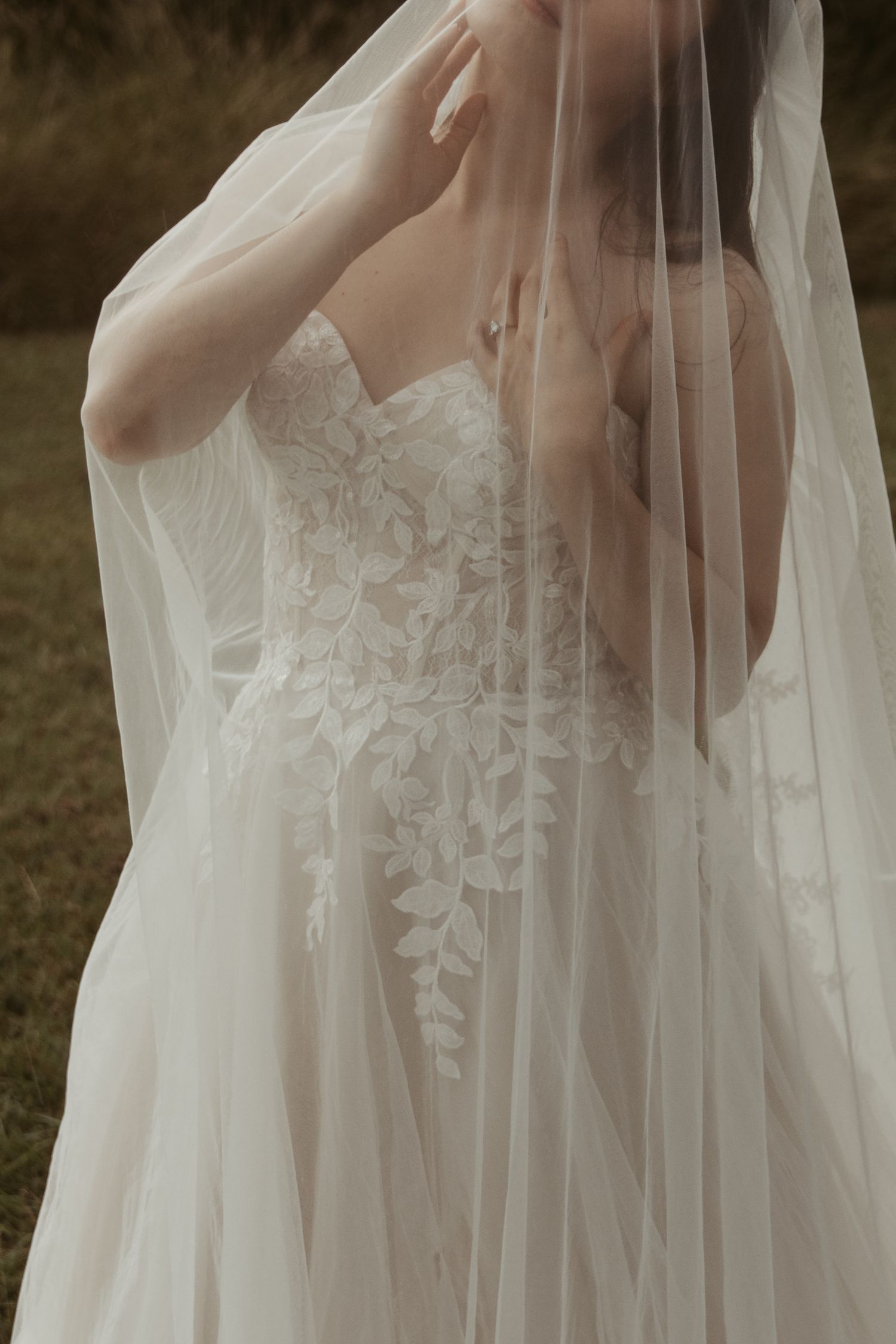 Close-up detail shots of delicate white lace and tulle wedding dress fabric with intricate floral patterns.