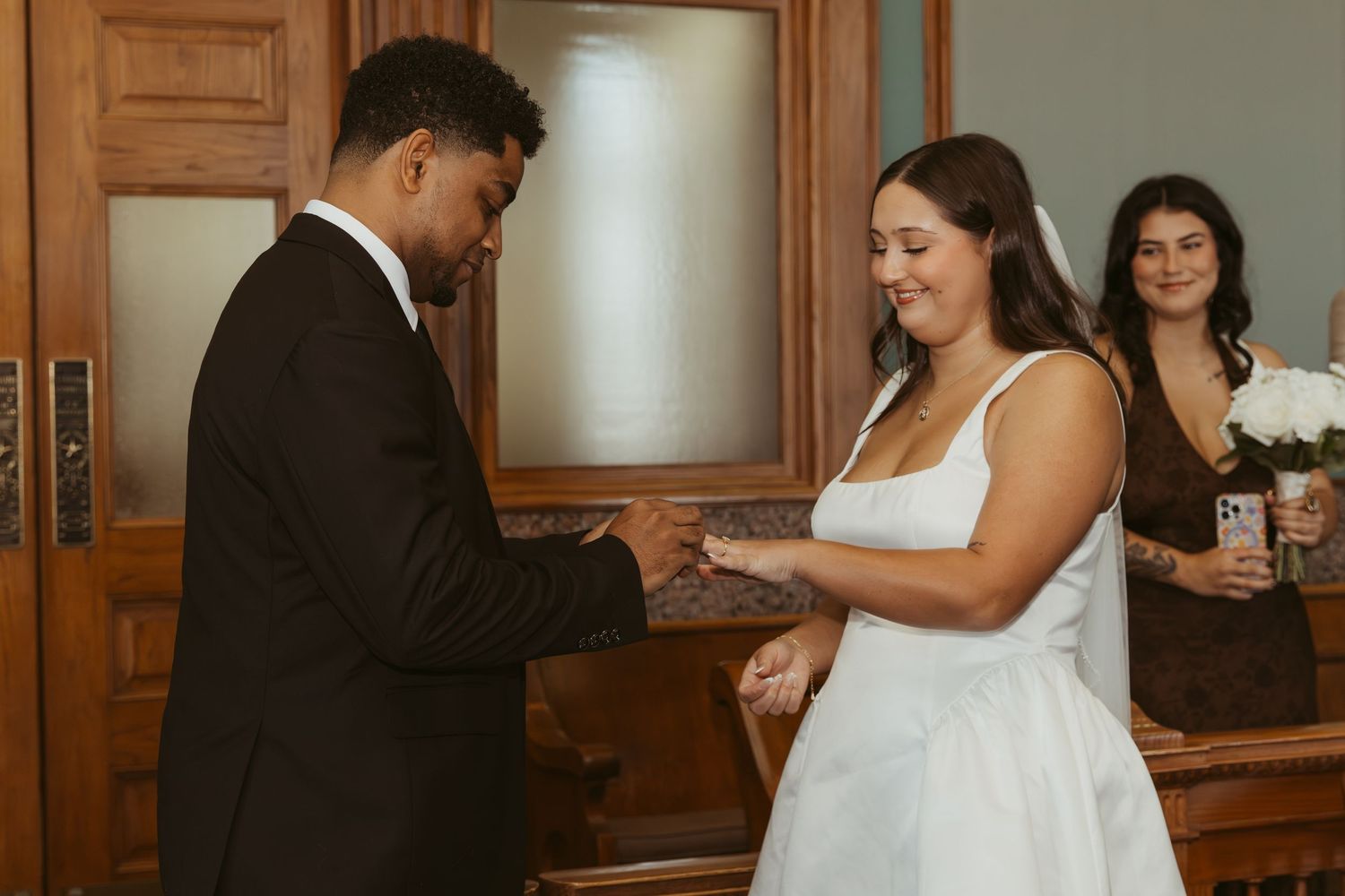 Candid wedding moments captured in sequence showing a couple dancing and celebrating indoors. Wedding Photographer DFW