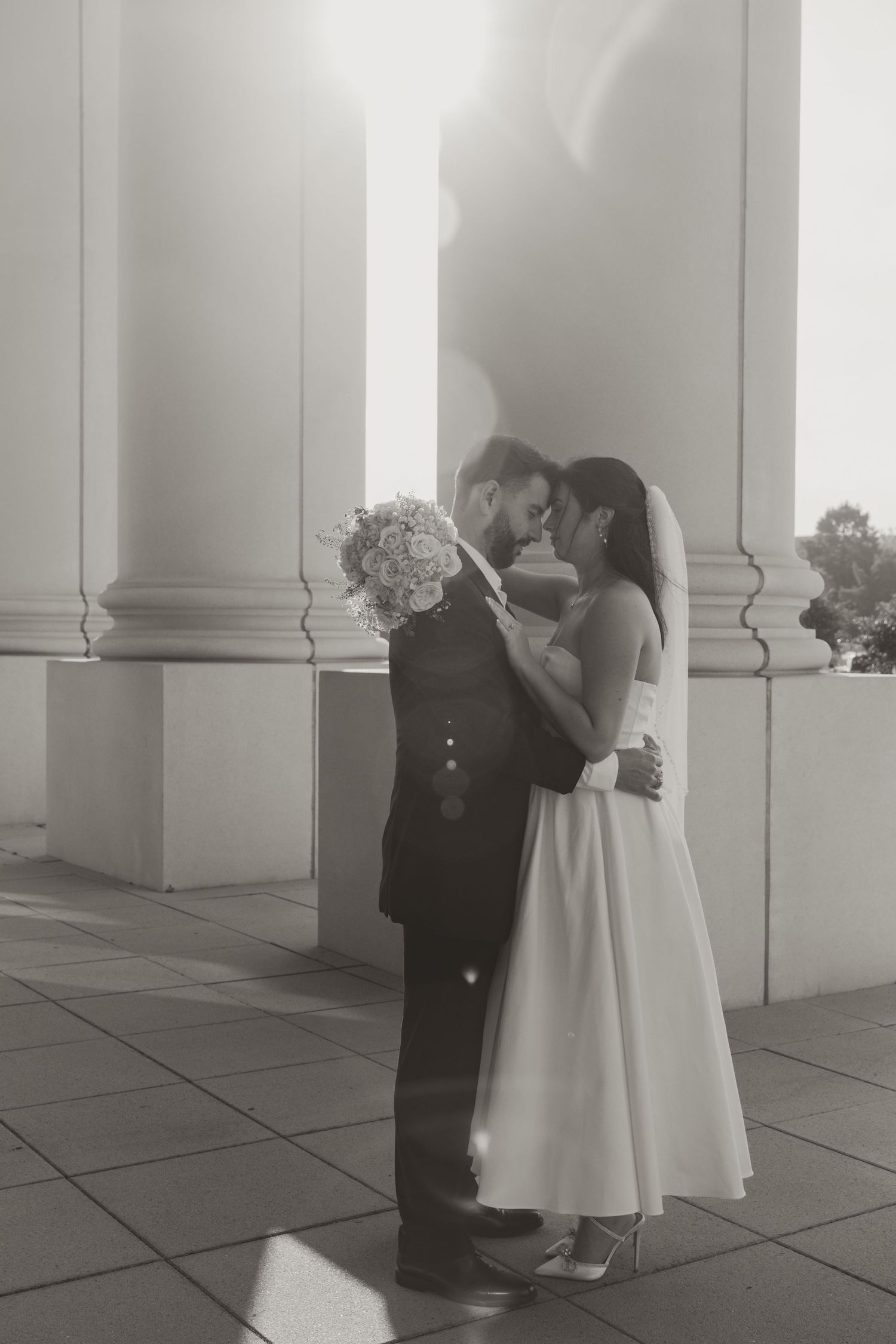 A series of intimate wedding moments photographed in soft focus against white architectural columns. Wedding Photographer DFW