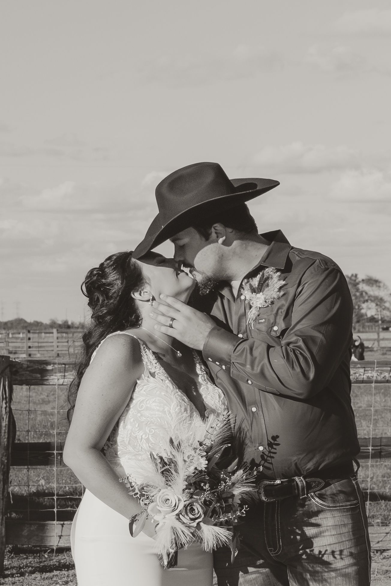 Black and white romantic wedding photo sequence showing a couple in western attire sharing an intimate kiss outdoors. Wedding photographer D