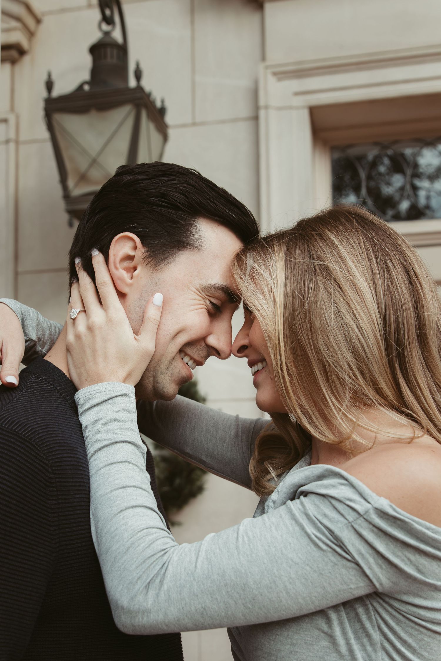 A series of romantic photos showing a couple embracing and laughing together against a light-colored wall. engagement photos Fort Worth