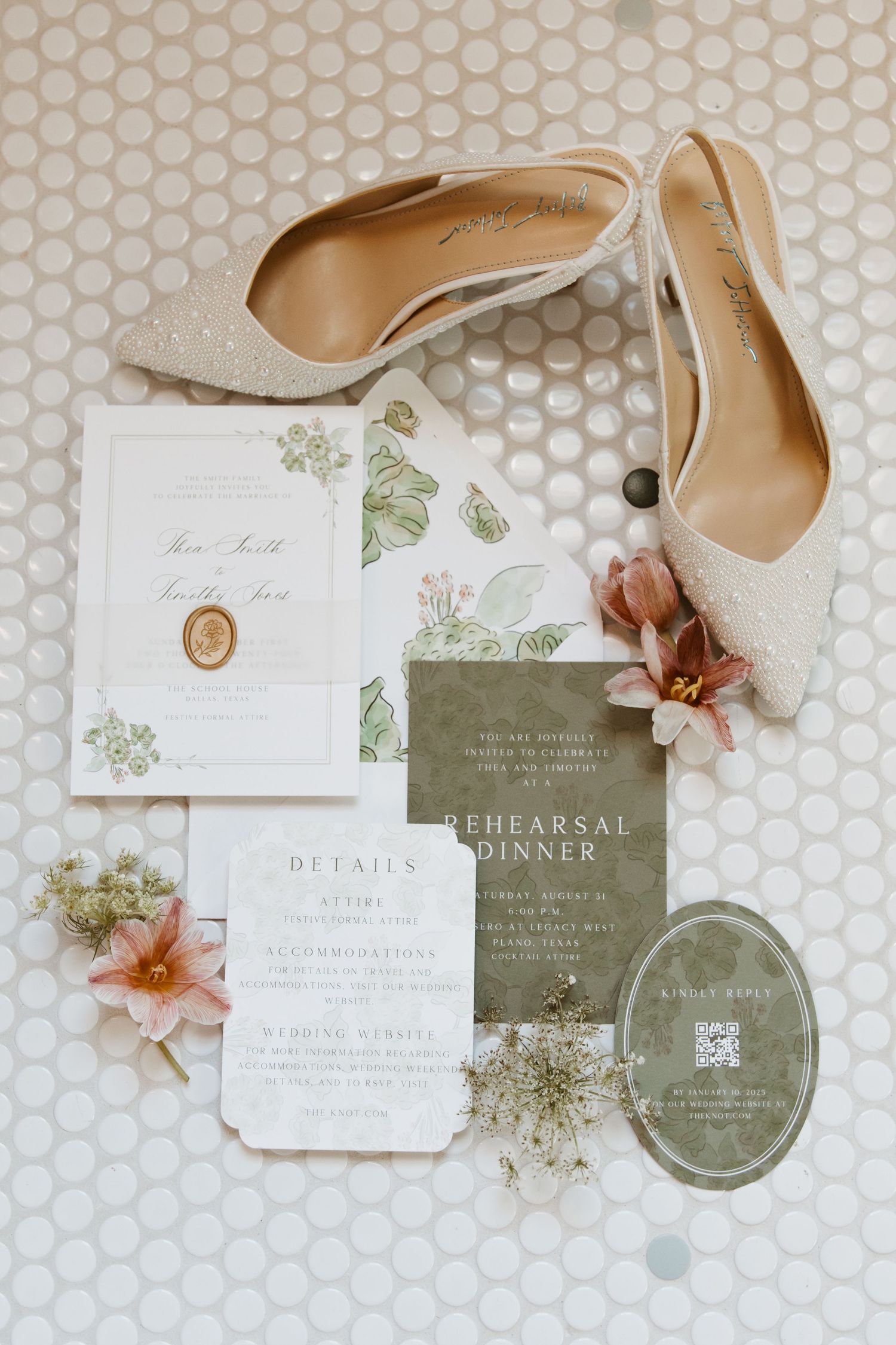 Elegant wedding invitation suite with sage green and white cards, delicate floral details, and nude heels on hexagonal tile.