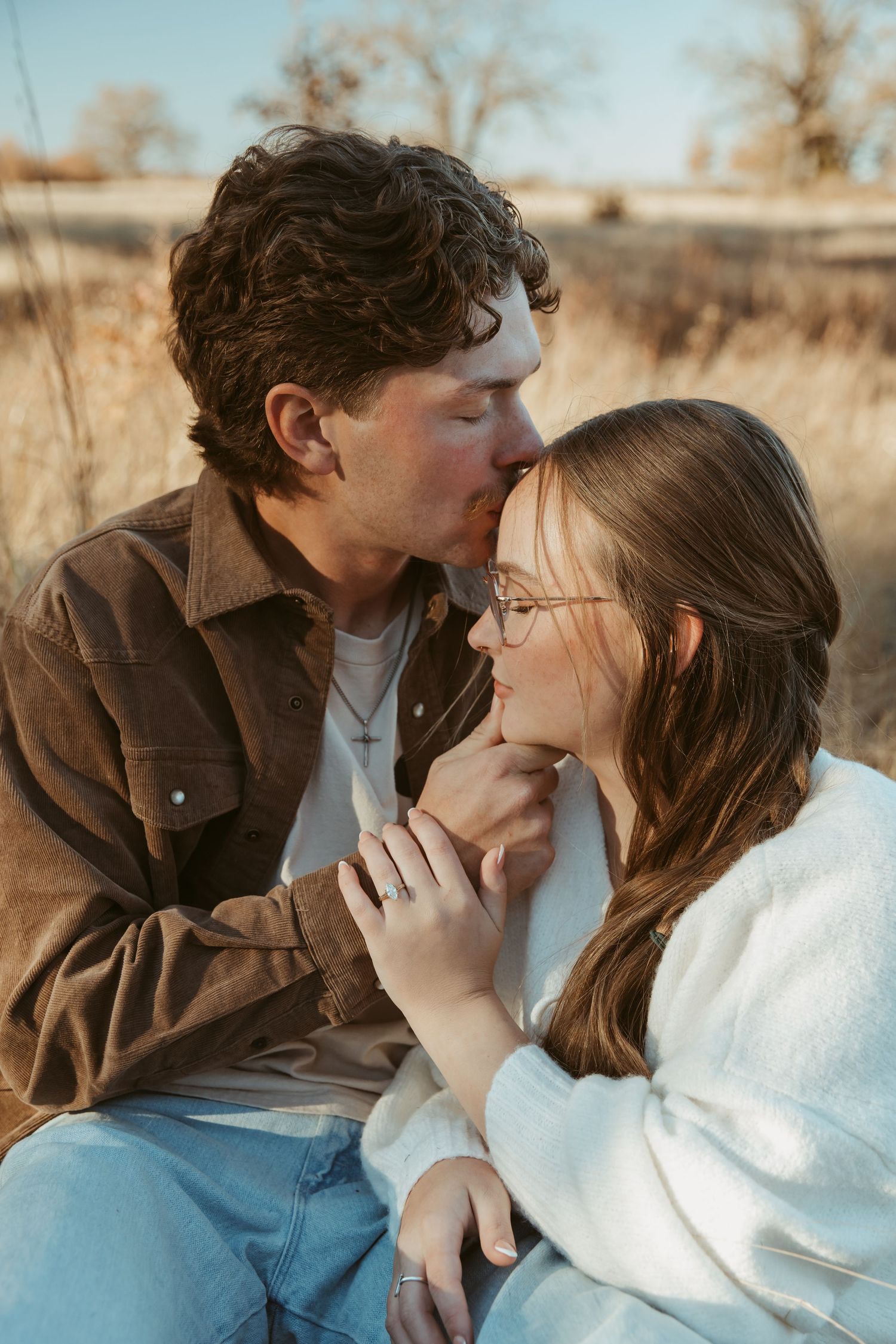 A romantic couple shares tender moments in a series of intimate outdoor portraits at sunset. engagement photos DFW