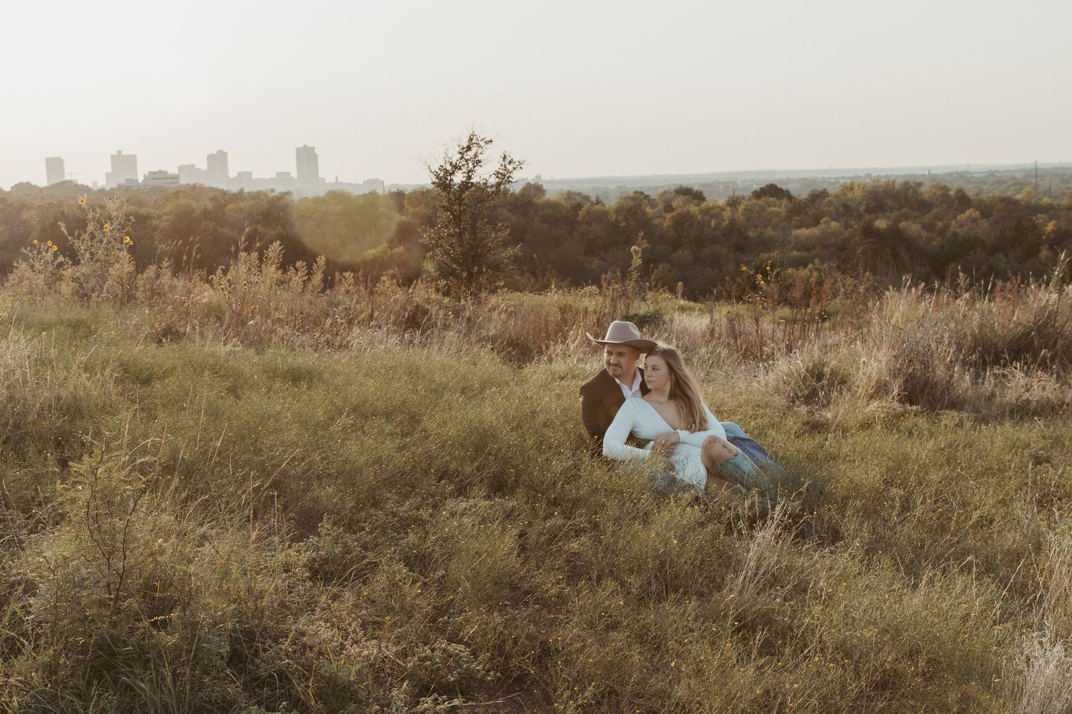 A collection of scenic landscape photos showing grassy fields and distant cityscapes in muted tones. Engagement photographer DFW