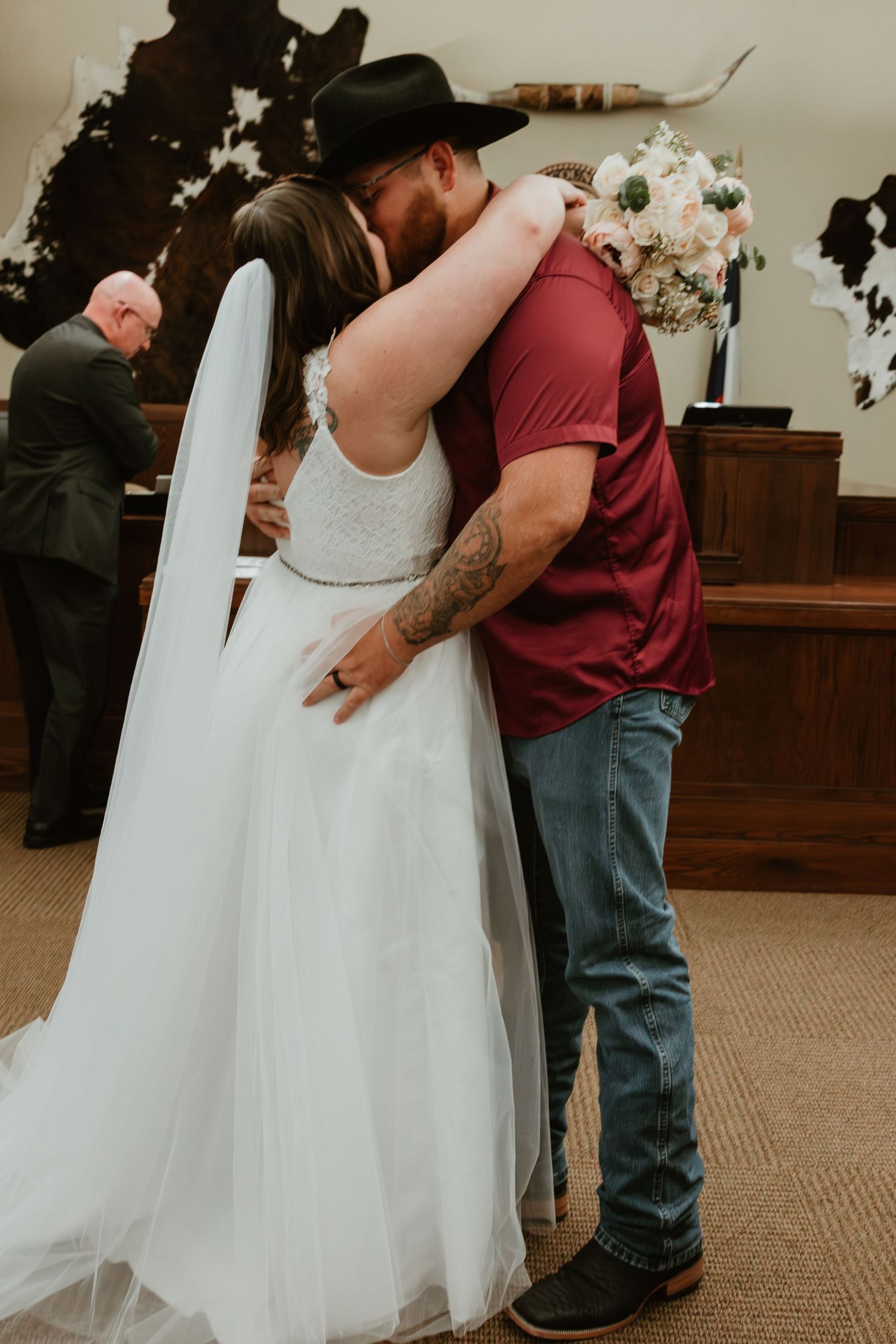 A couple shares an intimate moment in a church during their wedding ceremony.