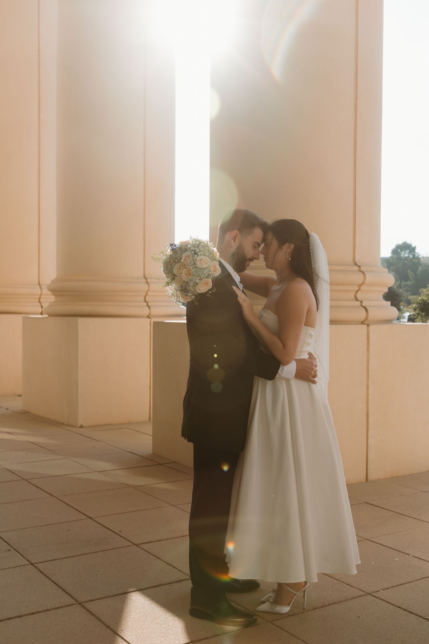 A series of romantic wedding portraits captured against soft lighting and classical architecture. Wedding Photographer Fort Worth