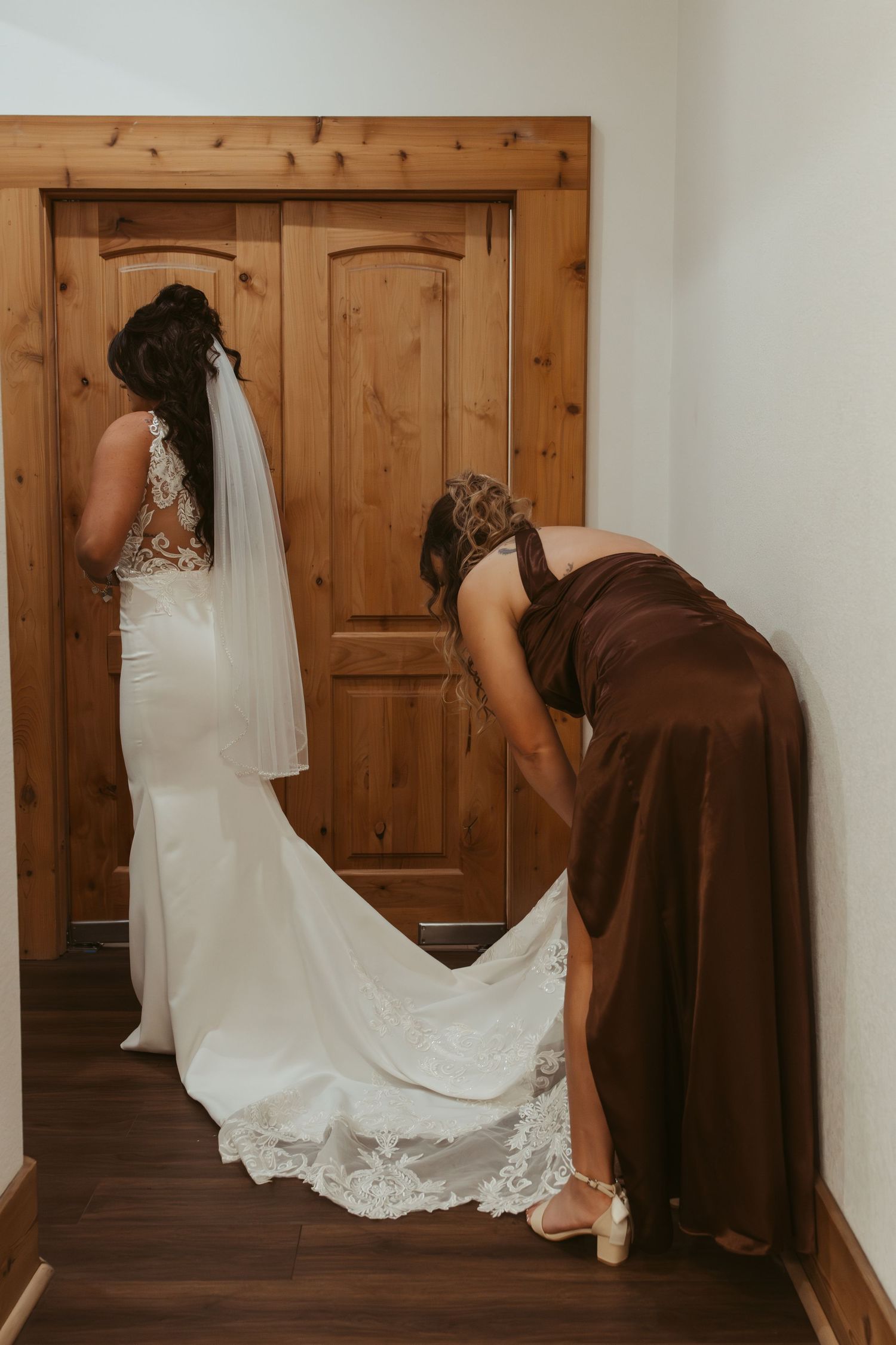 Series of wedding photos showing a bride in white dress and bridesmaid in brown dress praying together before ceremony. Wedding photographer
