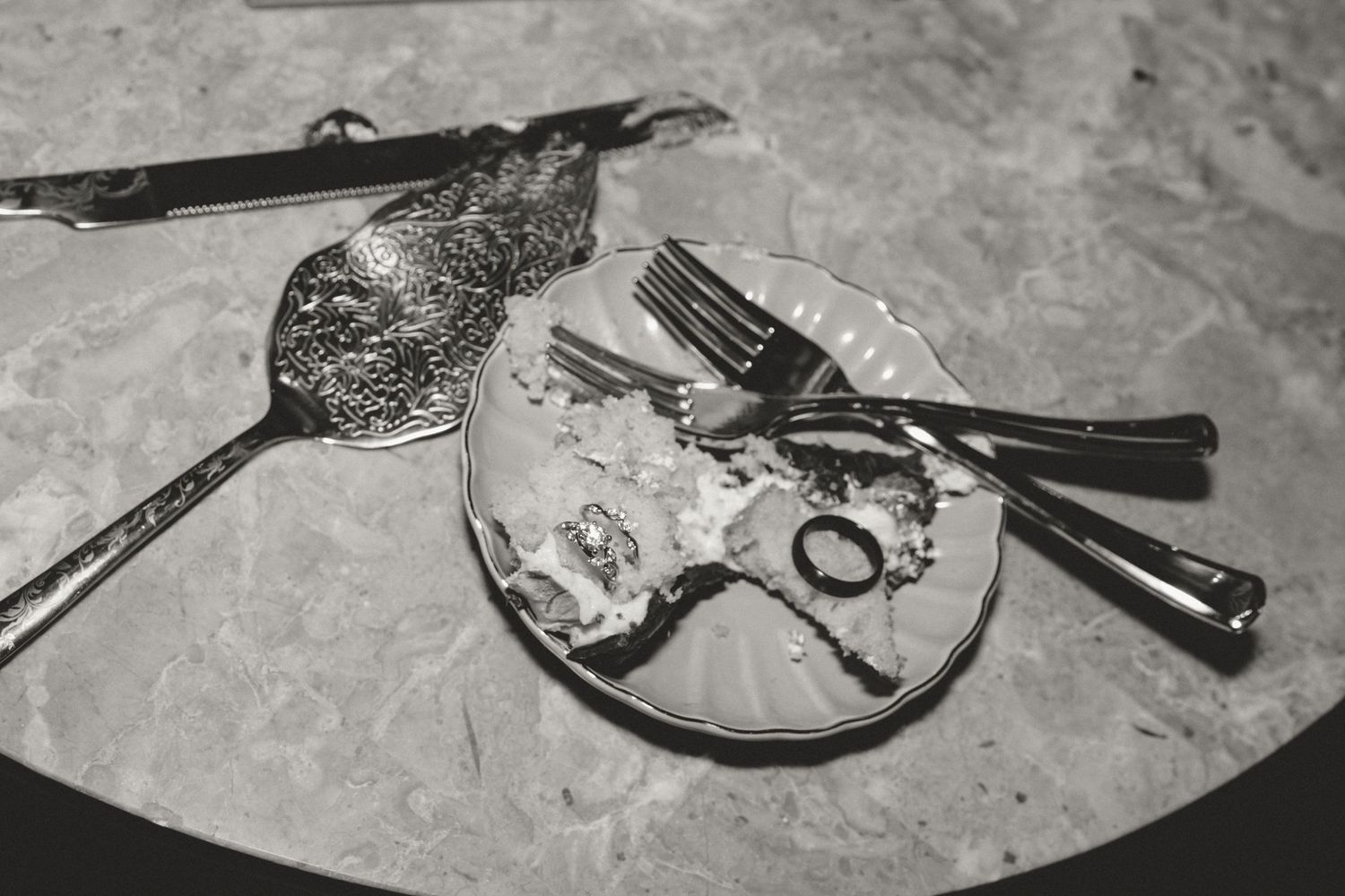 Black and white photograph of vintage keys and decorative elements on a textured surface.