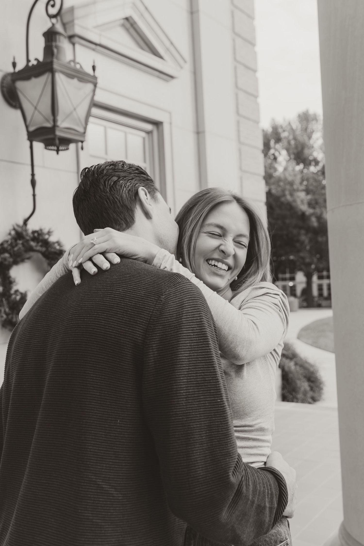 Black and white photo sequence showing a couple embracing in a tender moment on a porch with white columns. engagement photos Fort Worth