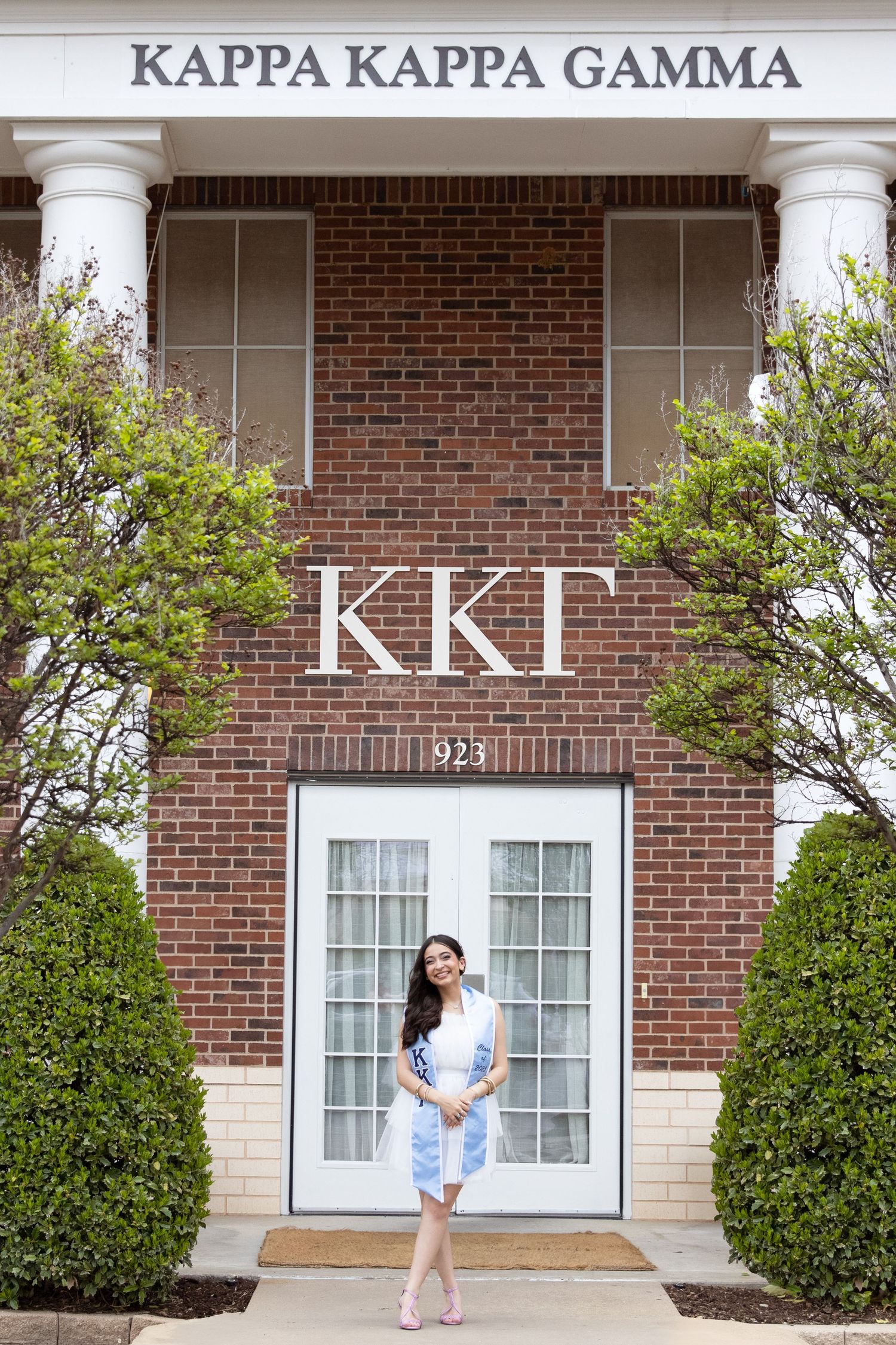 Kappa Kappa Gamma sorority house exterior with white columns and brick facade.