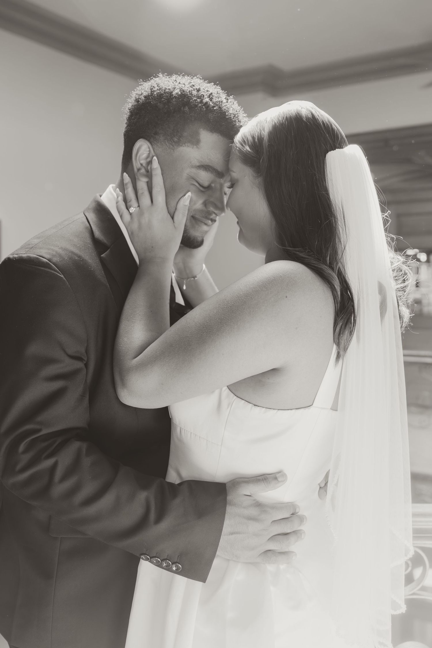 A series of romantic black and white photos showing a couple embracing during their first look wedding moment. Wedding Photographer DFW