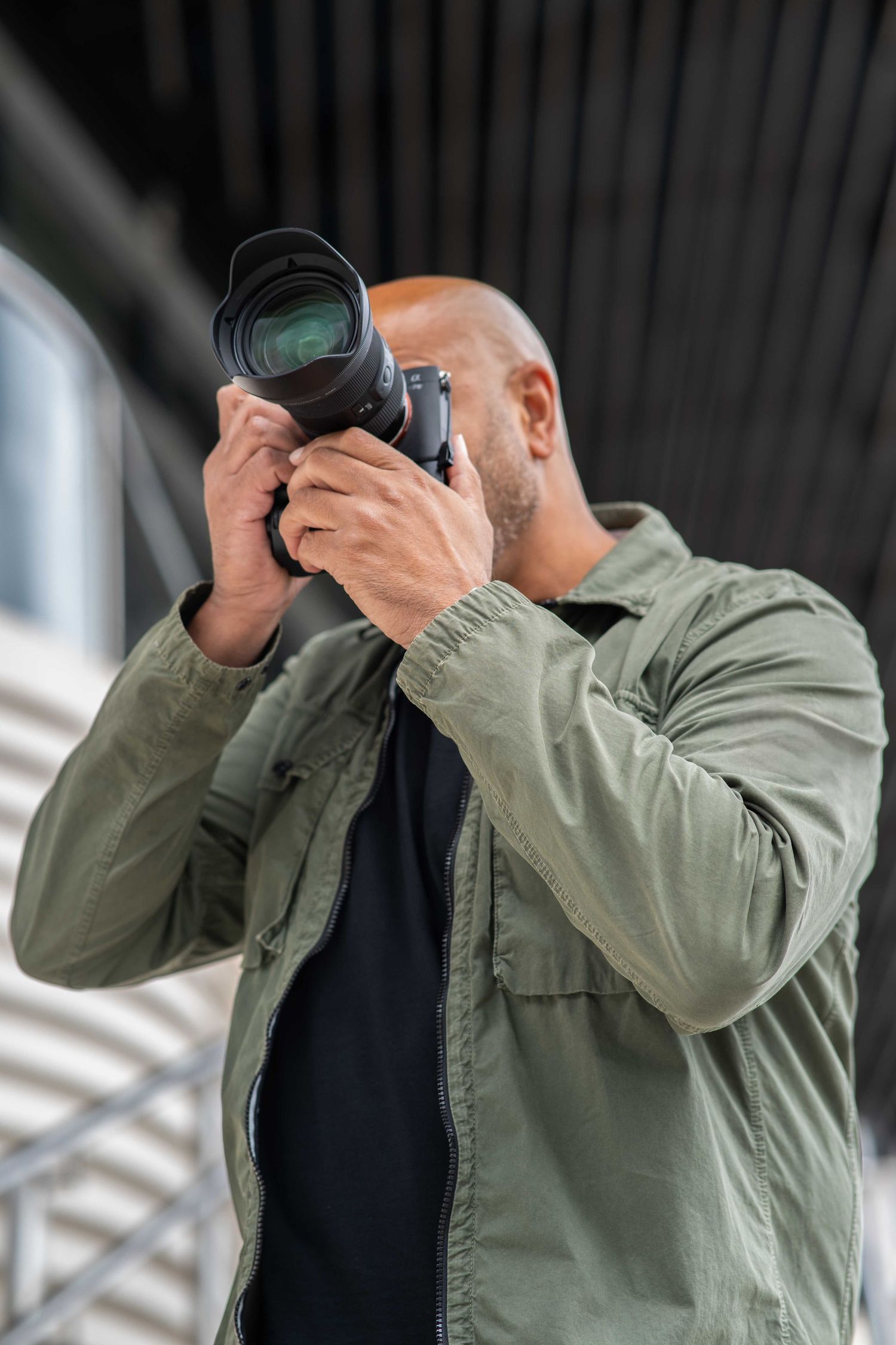 Steve Currie, personal branding photographer, takes a picture on his camera in Southampton.